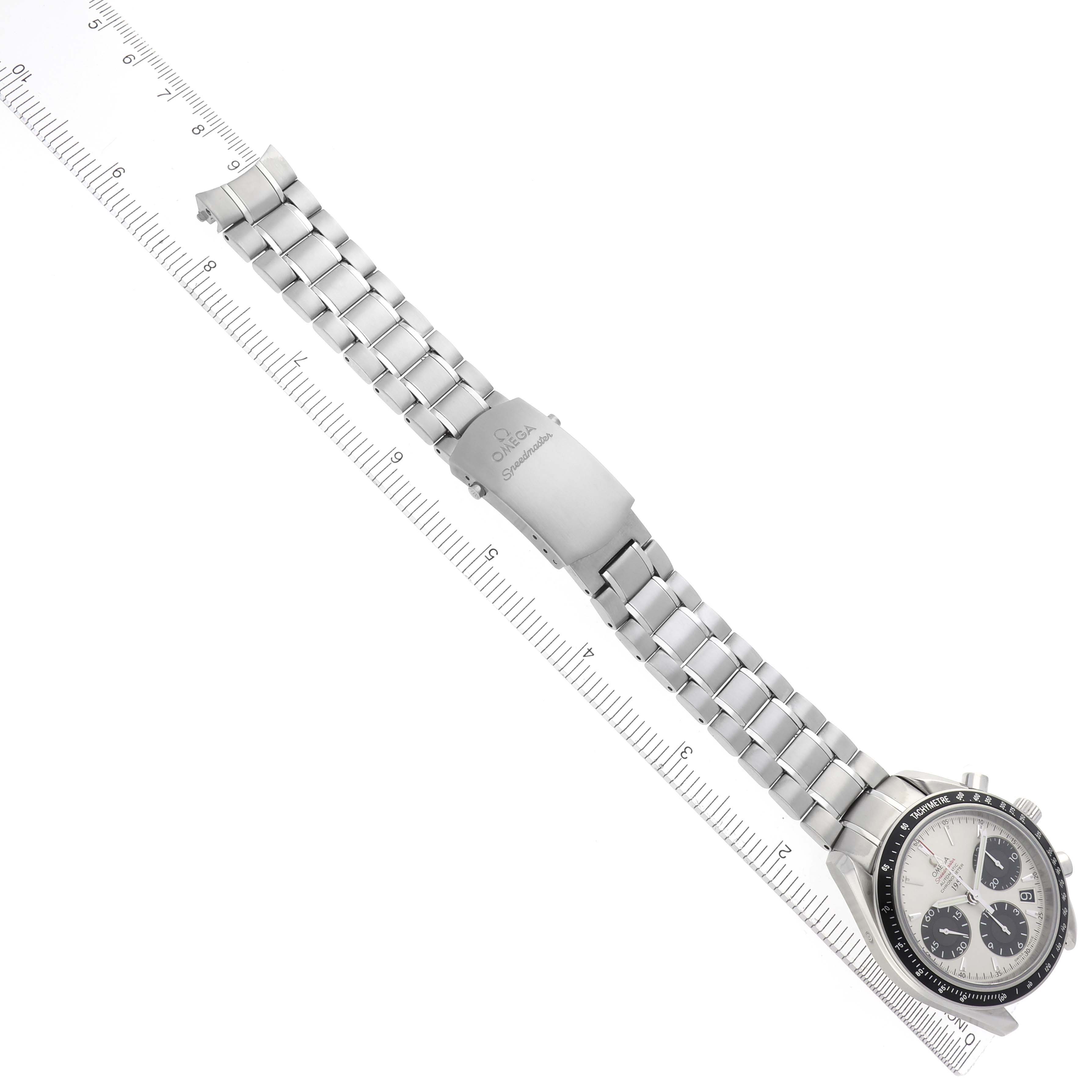 The Omega Speedmaster 323.30.40.40.02.001 Men
s Stainless Steel White Dial 323.30.40.40.02.001 Men
s Stainless Steel White Dial watch is shown from an angled top view, highlighting the bracelet and clasp alongside a ruler for scale.