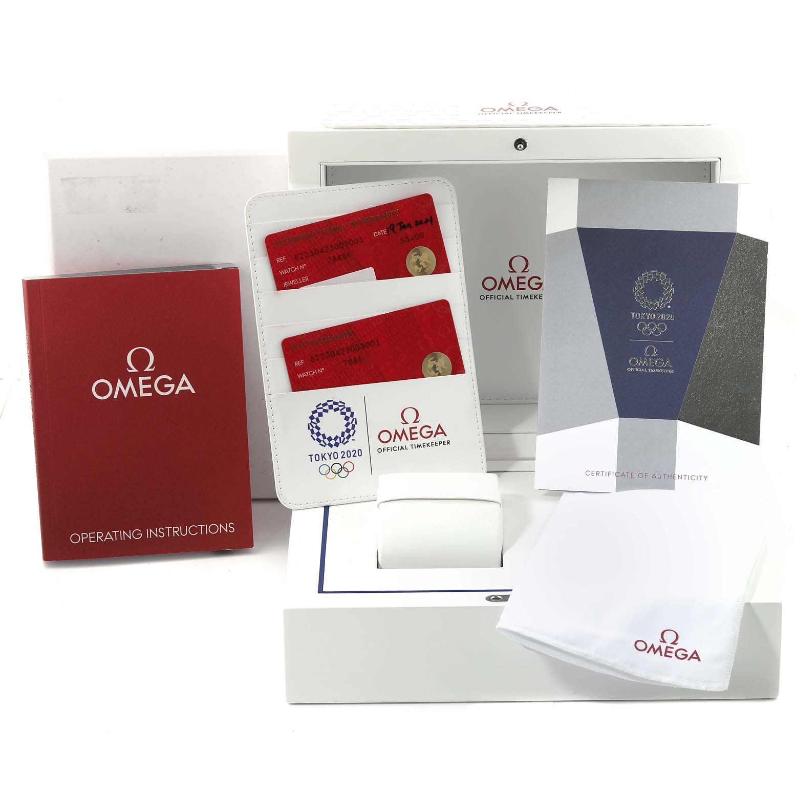 The image shows the accessories for an Omega Speedmaster 522.30.42.30.03.001 Men's Stainless Steel Blue Dial 522.30.42.30.03.001 Men's Stainless Steel Blue Dial including the box, operating instructions, cards, and certificate of authenticity.