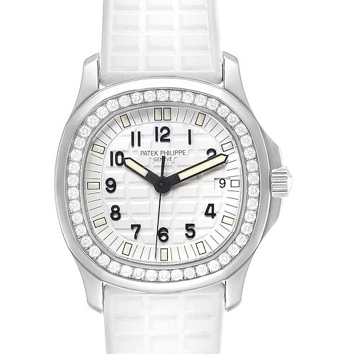 The image shows a front view of the Patek Philippe Aquanaut watch, featuring its textured dial, diamond bezel, and white strap.