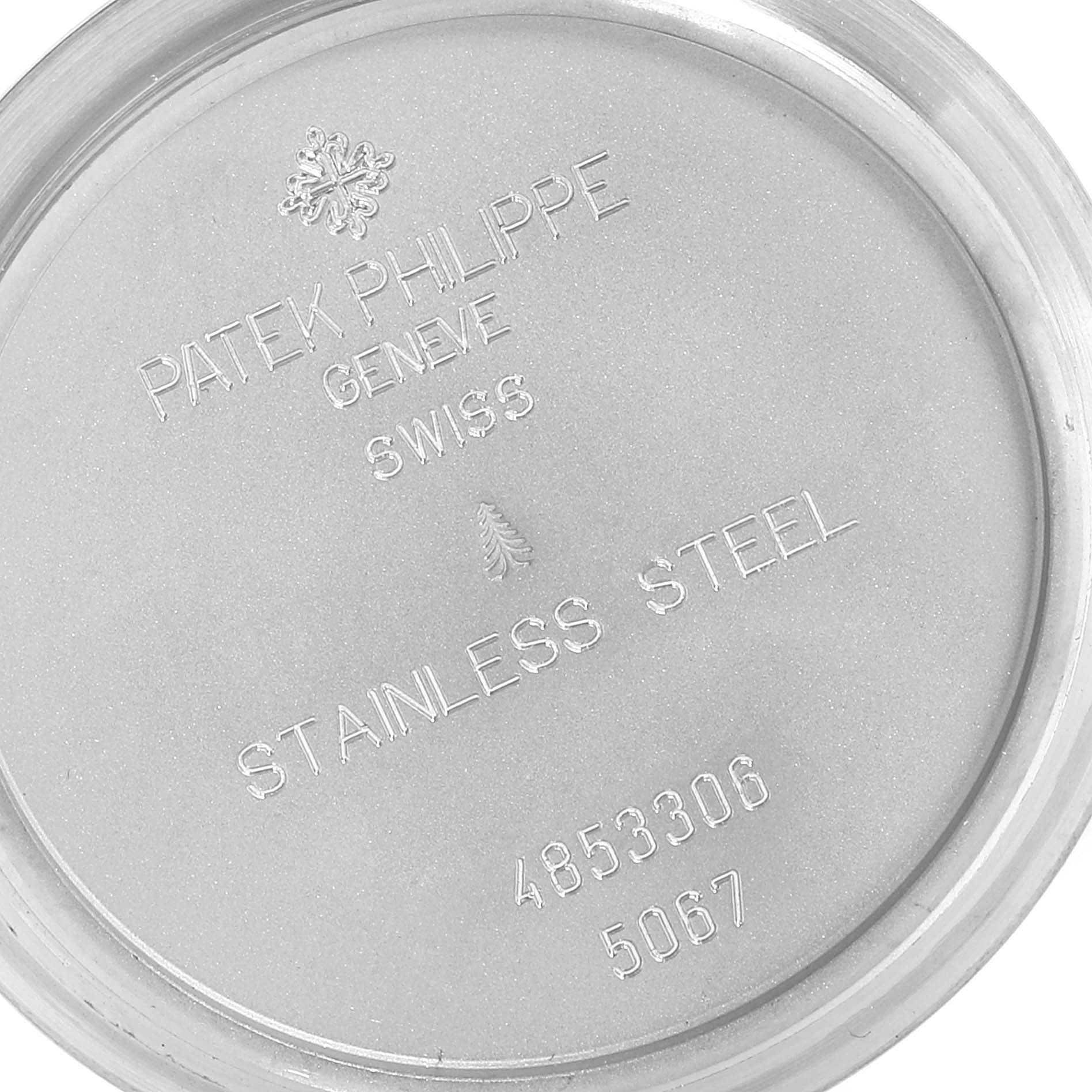 This image shows the inner case back of a Patek Philippe Aquanaut 5067 Women's Stainless Steel White Dial 5067 Women's Stainless Steel White Dial watch, featuring brand engravings and material details.