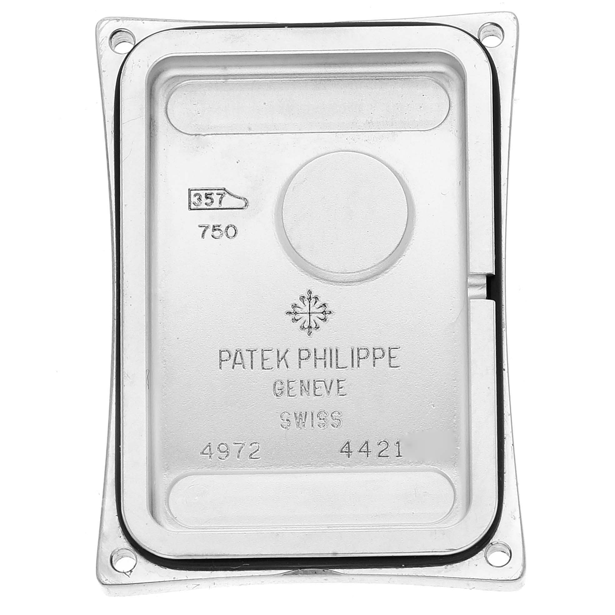 This image shows the back case of a Patek Philippe Gondolo 4972G-001 Women
s White Gold Mother of Pearl Dial 4972G-001 Women
s White Gold Mother of Pearl Dial watch, displaying the brand
s hallmarks and inscriptions.