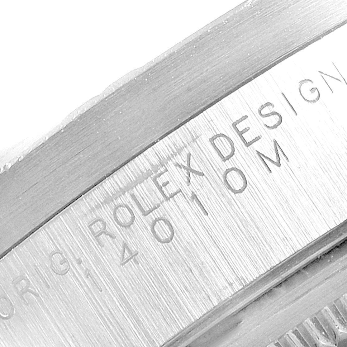 This is a close-up angle showing the engraved details on the bezel of a Rolex Air-King 14010 Men's Stainless Steel Black Dial 14010 Men's Stainless Steel Black Dial watch.