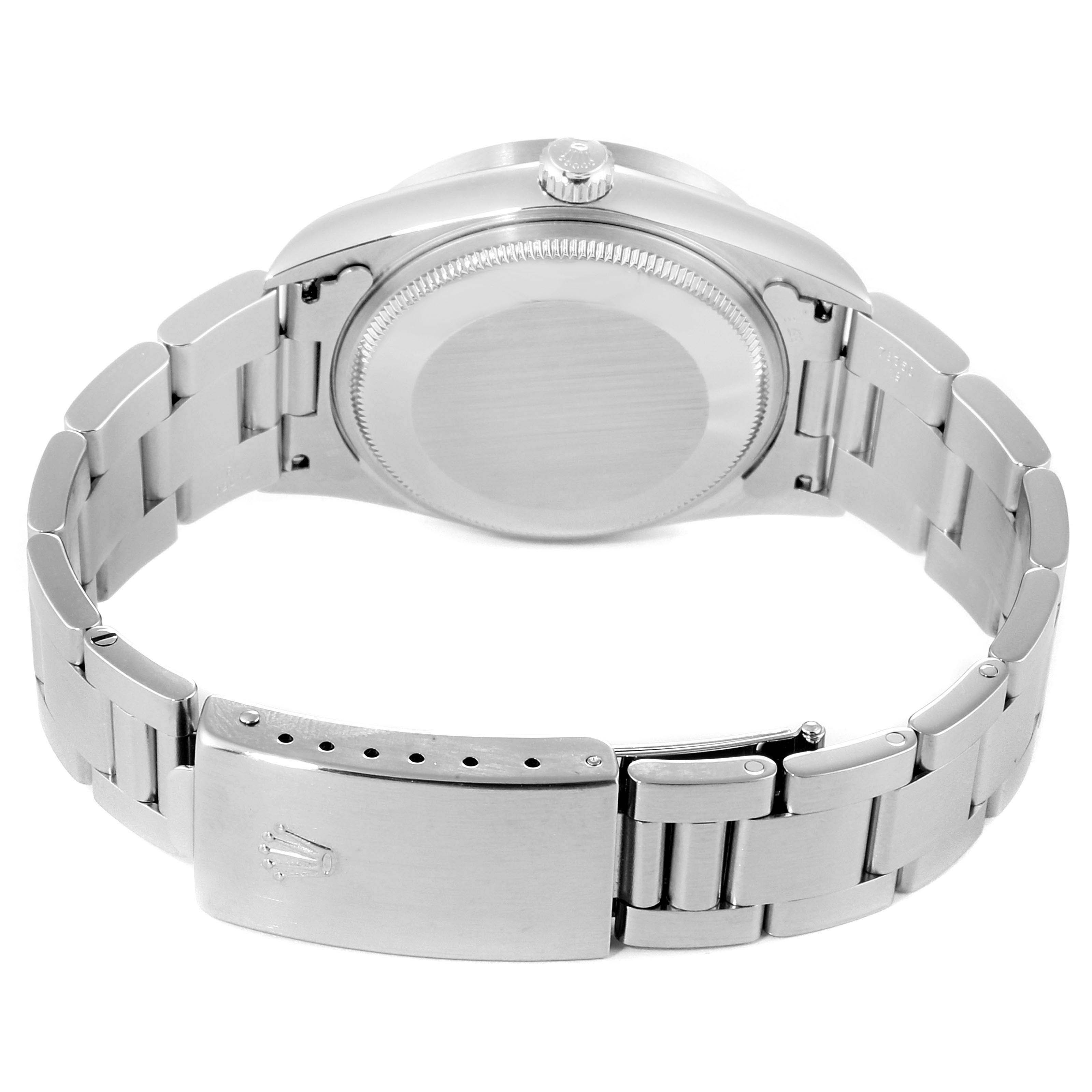 The image shows the back view of a Rolex Air-King 14010 Men's Stainless Steel Black Dial 14010 Men's Stainless Steel Black Dial watch, highlighting the case, crown, and bracelet clasp.