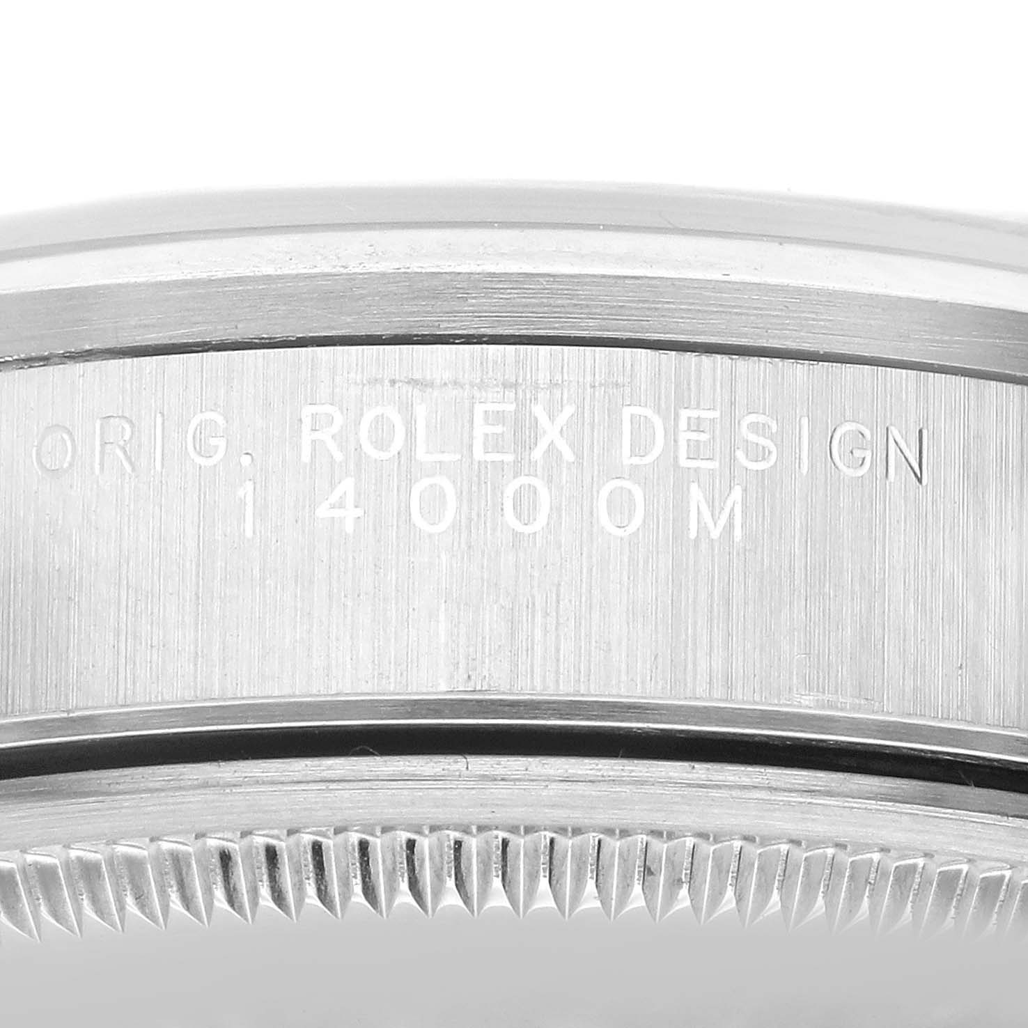 This image shows a close-up of the case back and rim of a Rolex Air-King 14000 Men's Stainless Steel Black Dial 14000 Men's Stainless Steel Black Dial model, displaying the "ROLEX DESIGN" engraving.