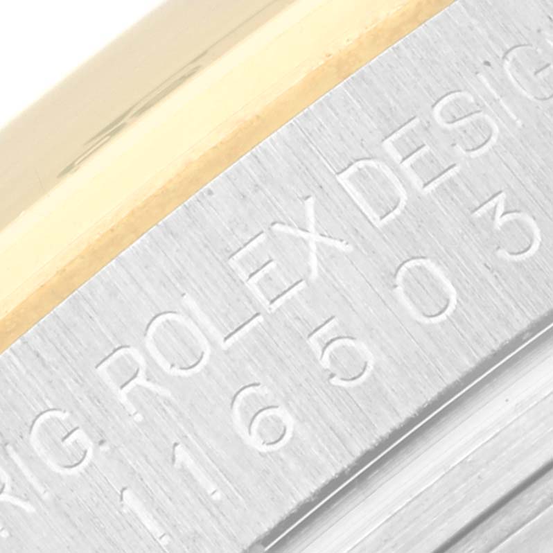 The image shows a close-up of the engraved model number on the side of a Rolex Daytona 116503 Men
s Steel and Gold (two tone) Black Dial 116503 Men
s Steel and Gold (two tone) Black Dial watch case.
