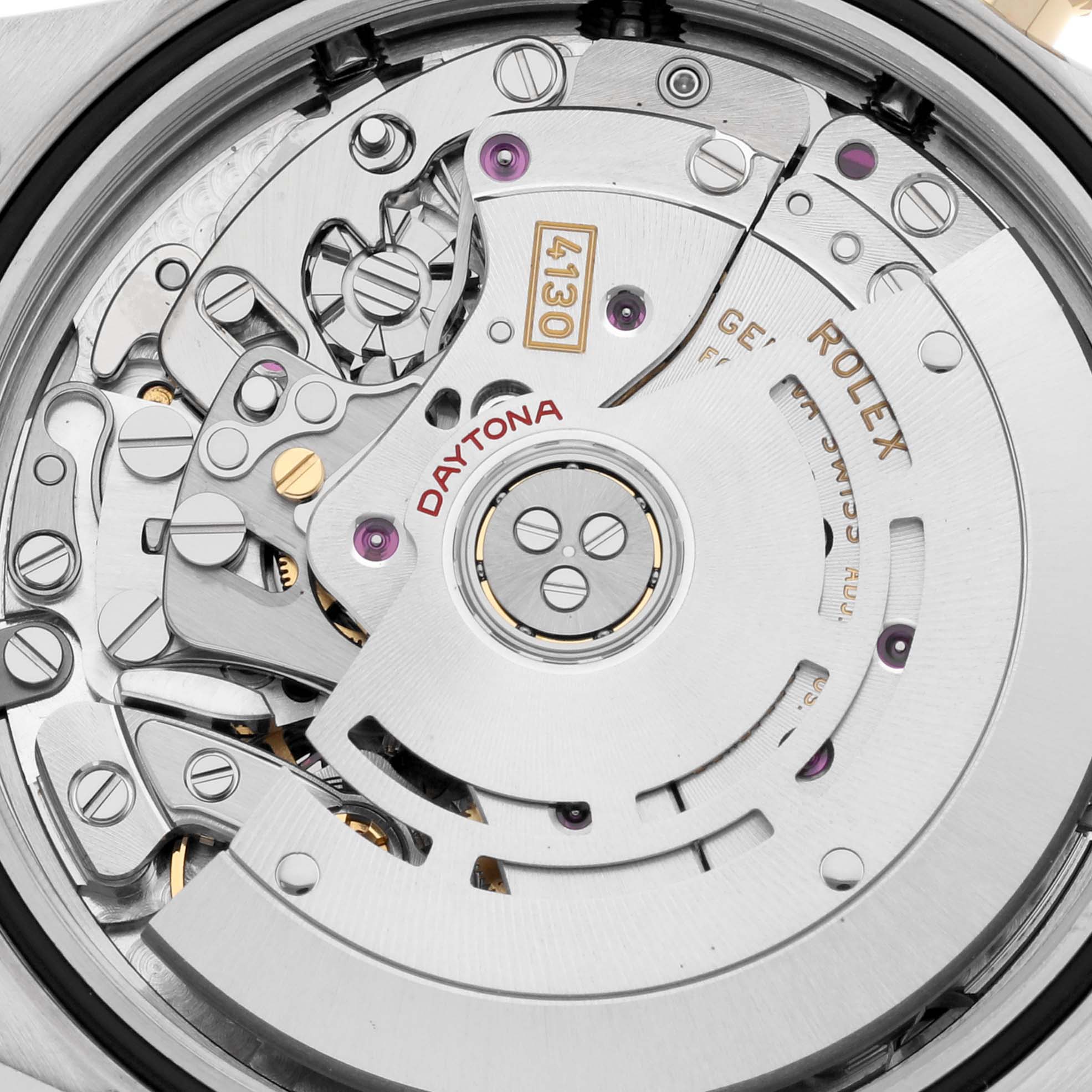 This image shows the intricate inner mechanism of a Rolex Daytona 116503 Men
s Steel and Gold (two tone) Black Dial 116503 Men
s Steel and Gold (two tone) Black Dial watch, highlighting its movement parts from a close-up angle.