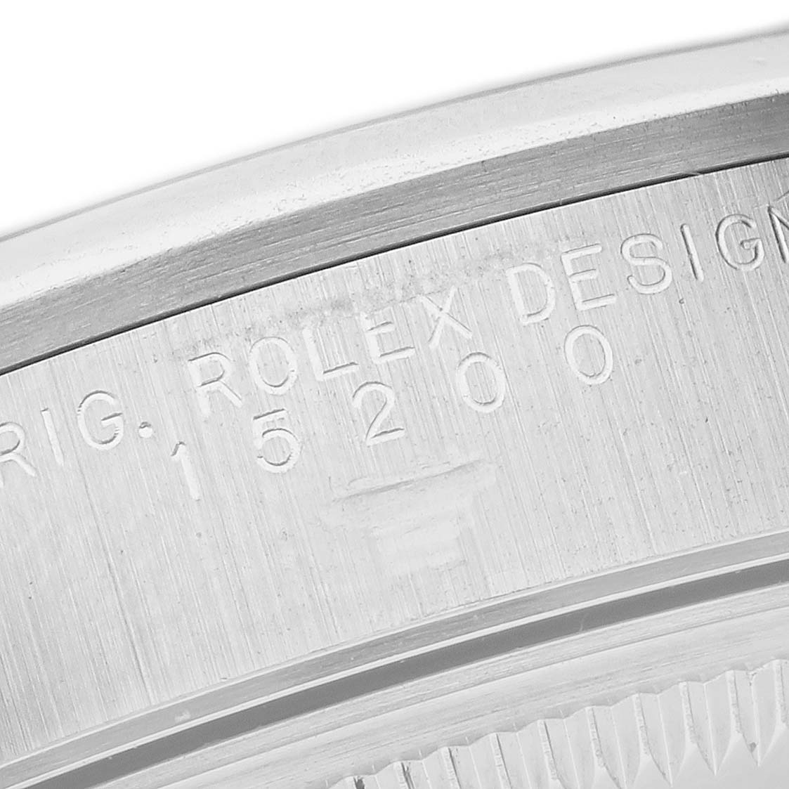 This is a close-up shot of the serial number engraving on the case of a Rolex Date 15200 Men
s Stainless Steel Black Dial 15200 Men
s Stainless Steel Black Dial model watch.