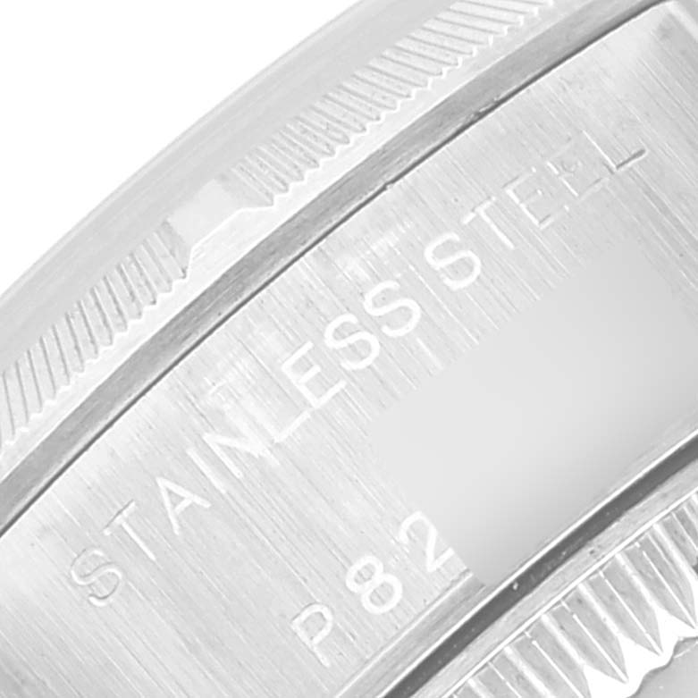 This is a macro shot of the side of a Rolex Date 79190 Women
s Stainless Steel Silver Dial 79190 Women
s Stainless Steel Silver Dial model watch, showing the "STAINLESS STEEL" engraving.