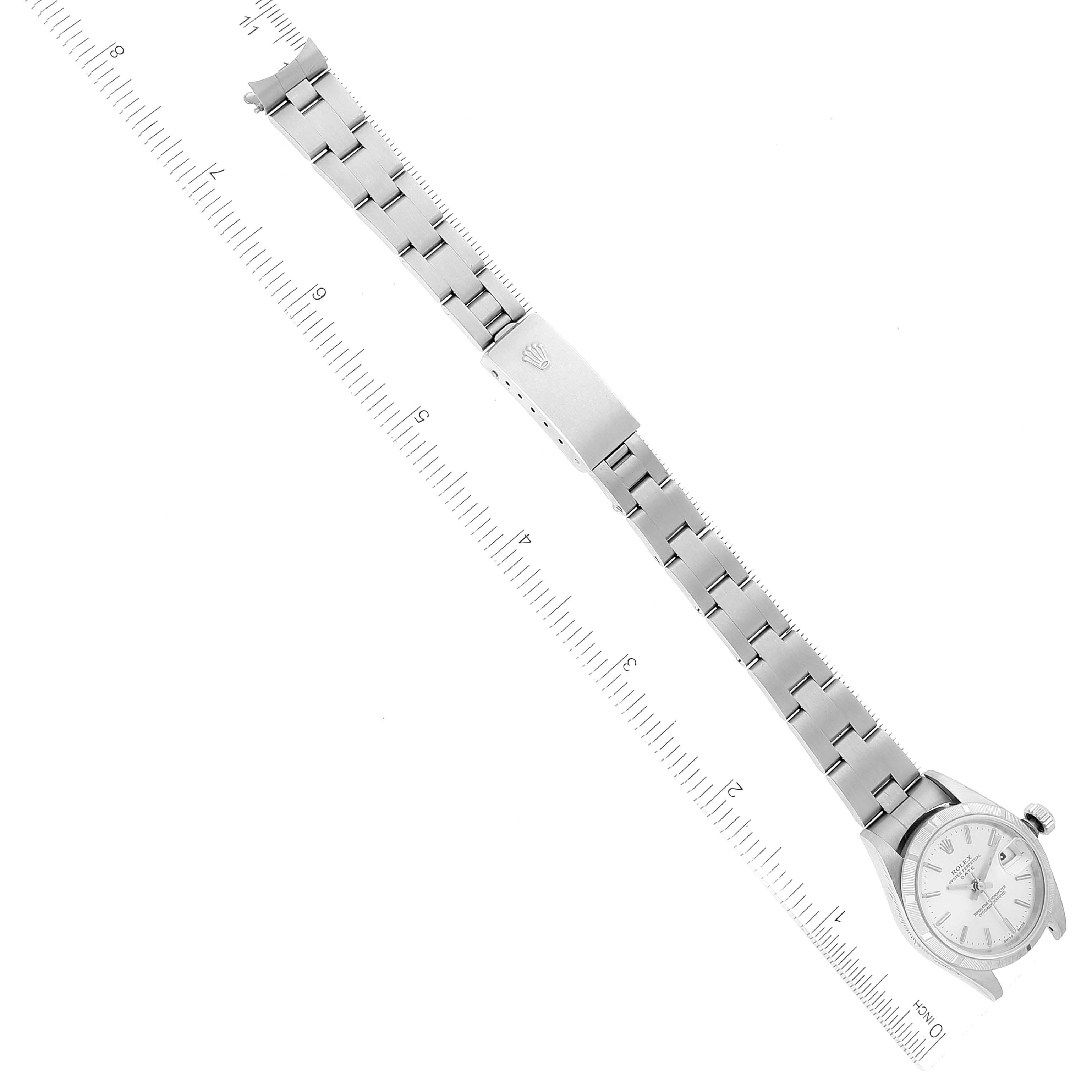 This image shows a Rolex Date 79190 Women
s Stainless Steel Silver Dial 79190 Women
s Stainless Steel Silver Dial watch from an aerial view, including its face, bezel, case, and full metal band with a clasp.