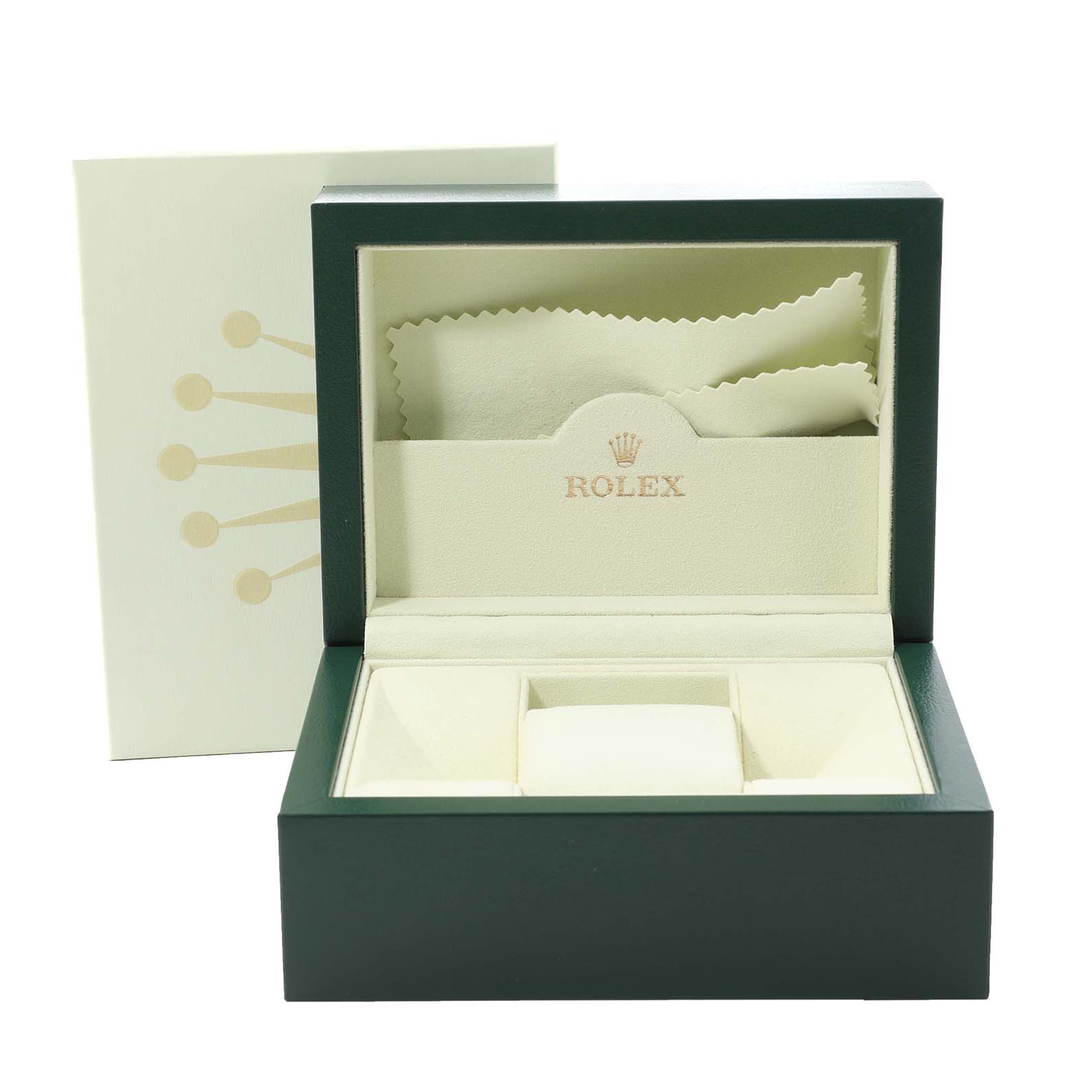 The image shows an open Rolex Date 115200 Men's Stainless Steel Blue Dial 115200 Men's Stainless Steel Blue Dial model watch box with a cream interior, including a cleaning cloth and cushion for the watch.