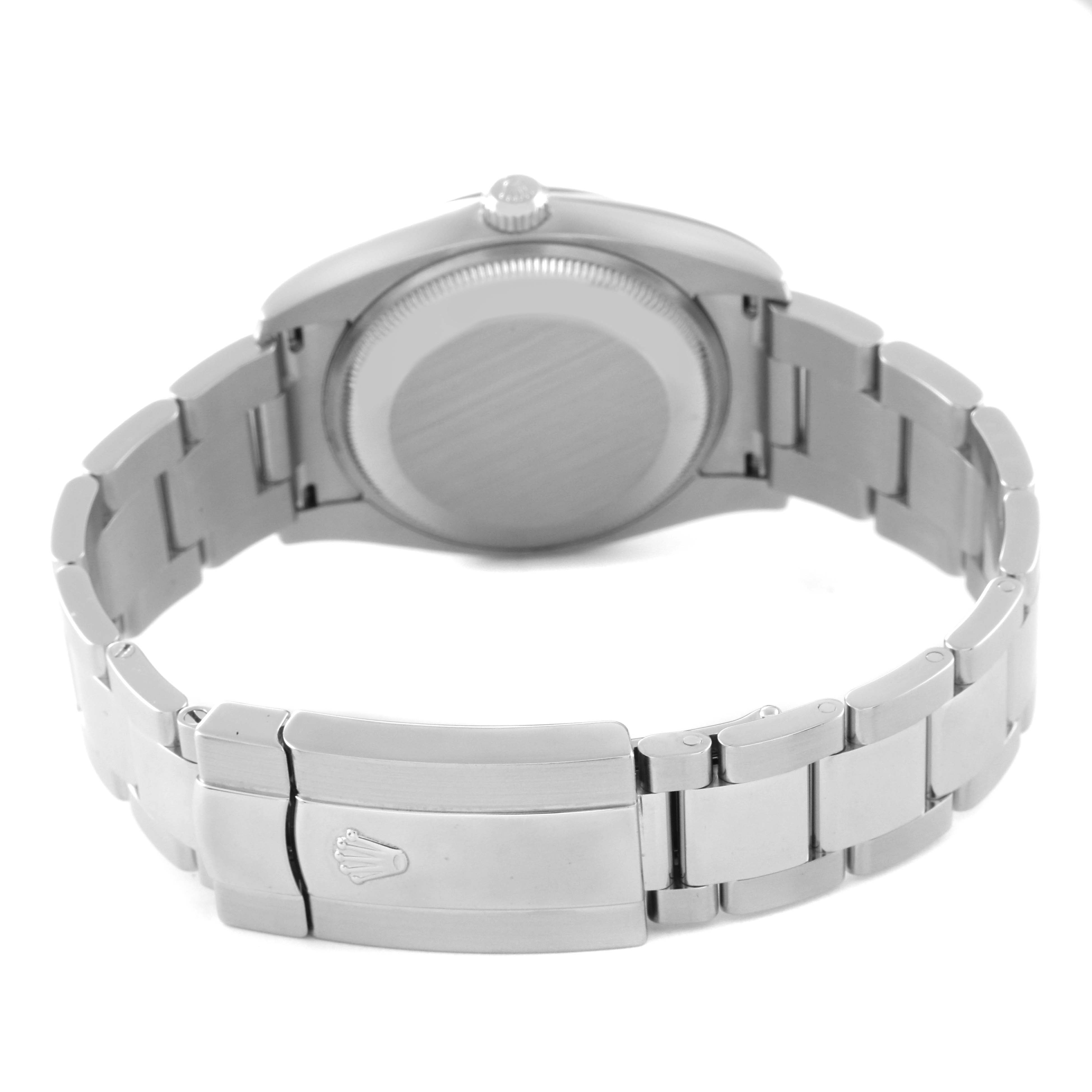 The image shows the back of a Rolex Date 115200 Men's Stainless Steel Blue Dial 115200 Men's Stainless Steel Blue Dial model watch, highlighting the case back, crown, and bracelet with clasp.