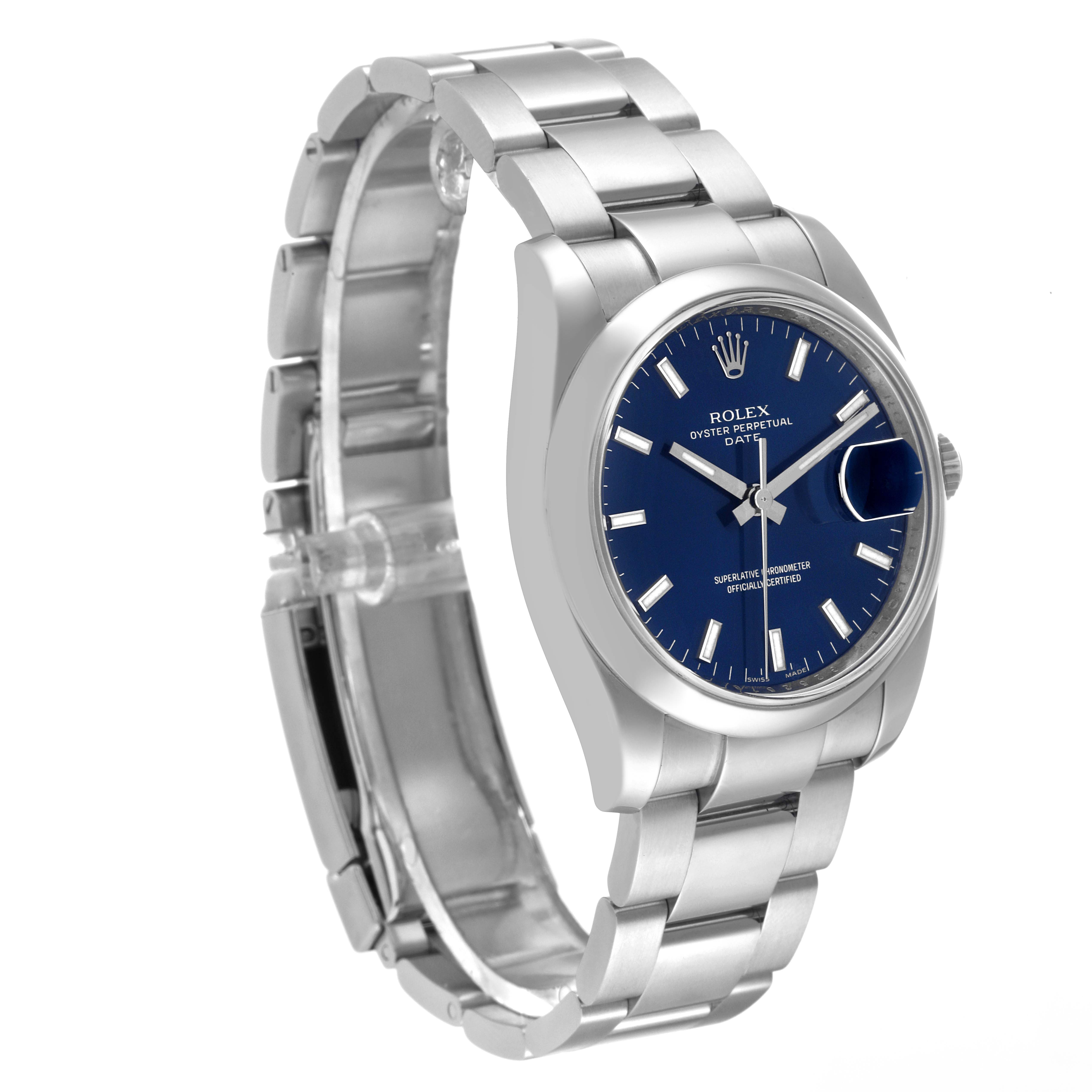 The image shows a side angle of a Rolex Date 115200 Men's Stainless Steel Blue Dial 115200 Men's Stainless Steel Blue Dial model watch, featuring its blue dial, bezel, and stainless steel bracelet.