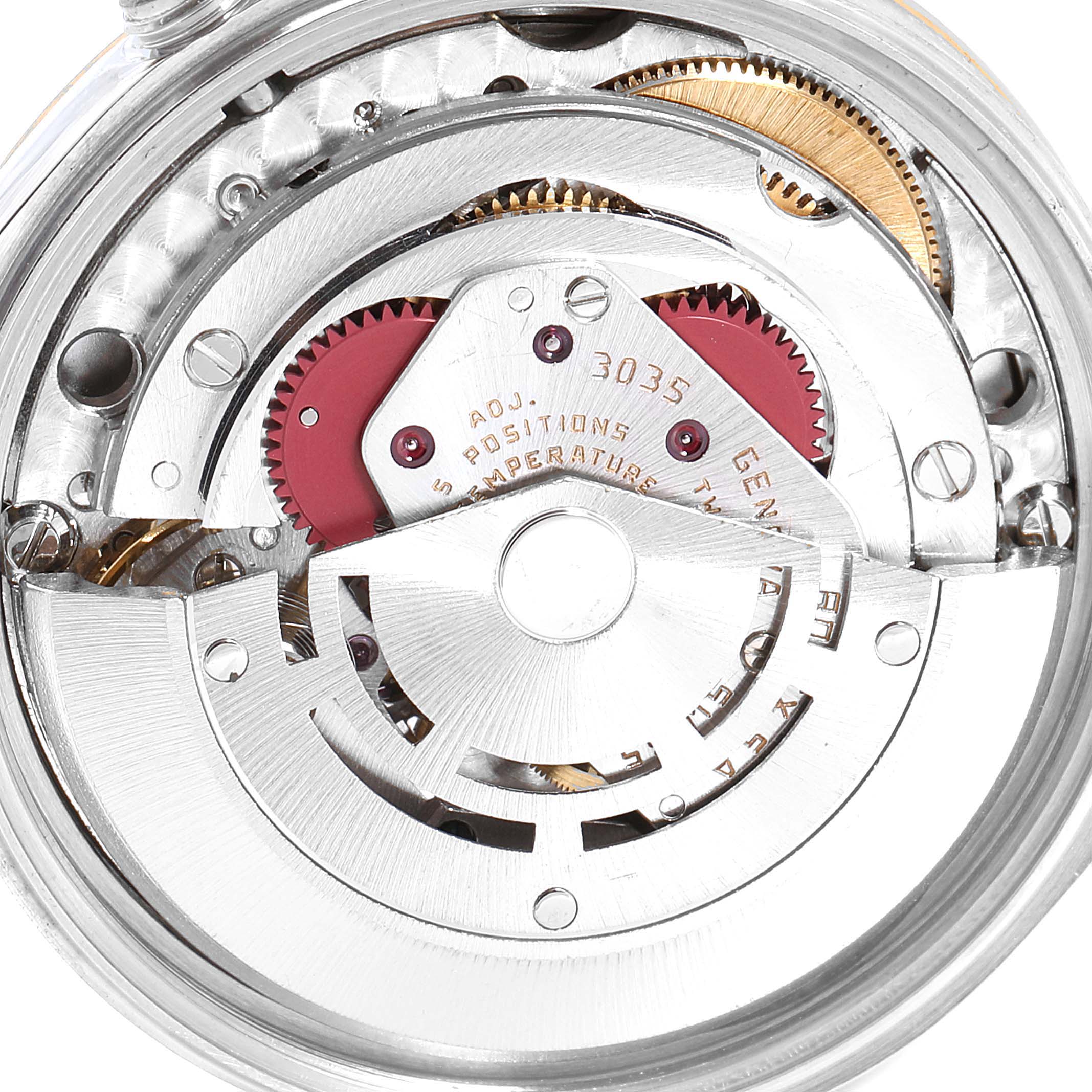 This image shows the intricate internal mechanical movement of the Vintage Collection Rolex watch from a back angle.