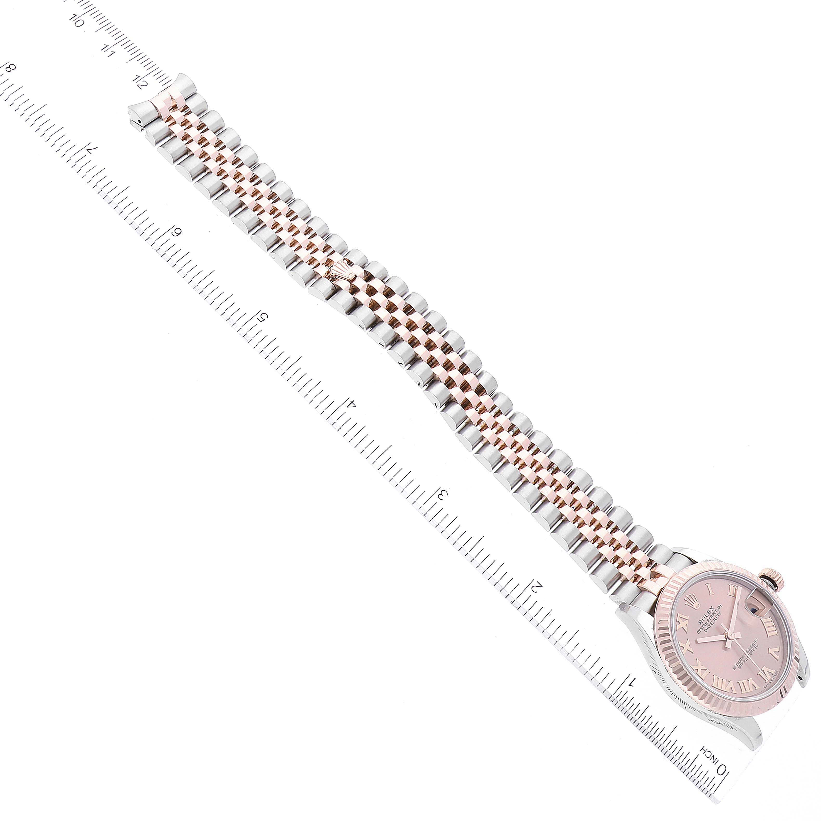 The image shows a Rolex Mid-Size 278271 Women's Steel and Gold (two tone) Pink Dial 278271 Women's Steel and Gold (two tone) Pink Dial model watch laid flat, highlighting the dial, bracelet, and clasp from a top-down angle.