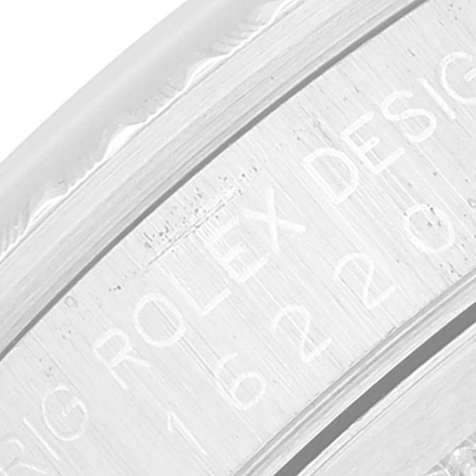 This image shows a close-up angle of the engraving on the side of the Rolex Datejust 16220 Men's Stainless Steel Pink Dial 16220 Men's Stainless Steel Pink Dial watch case.