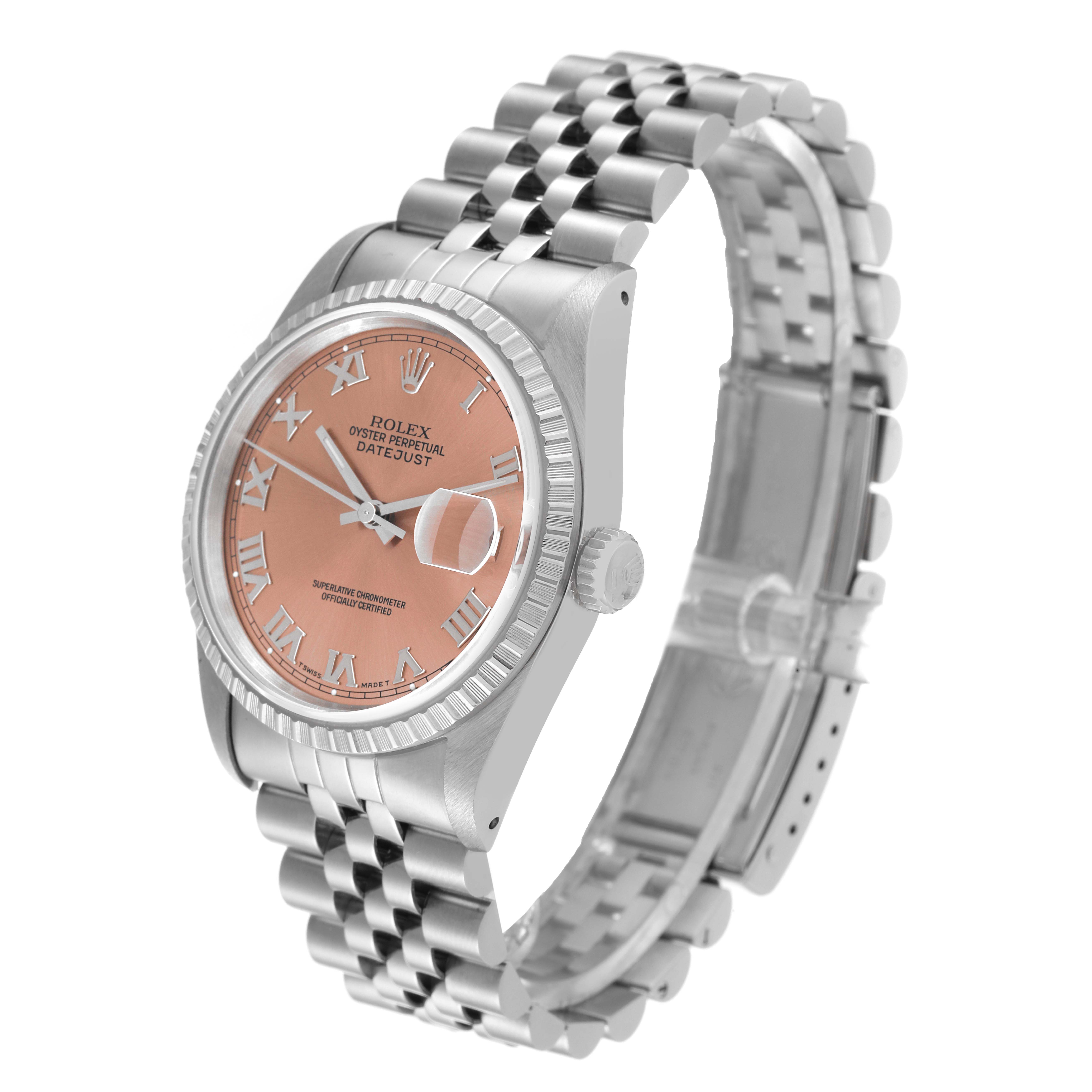 This Rolex Datejust 16220 Men's Stainless Steel Pink Dial 16220 Men's Stainless Steel Pink Dial watch is shown at an angled side view, displaying its pink dial, fluted bezel, and stainless steel Jubilee bracelet.