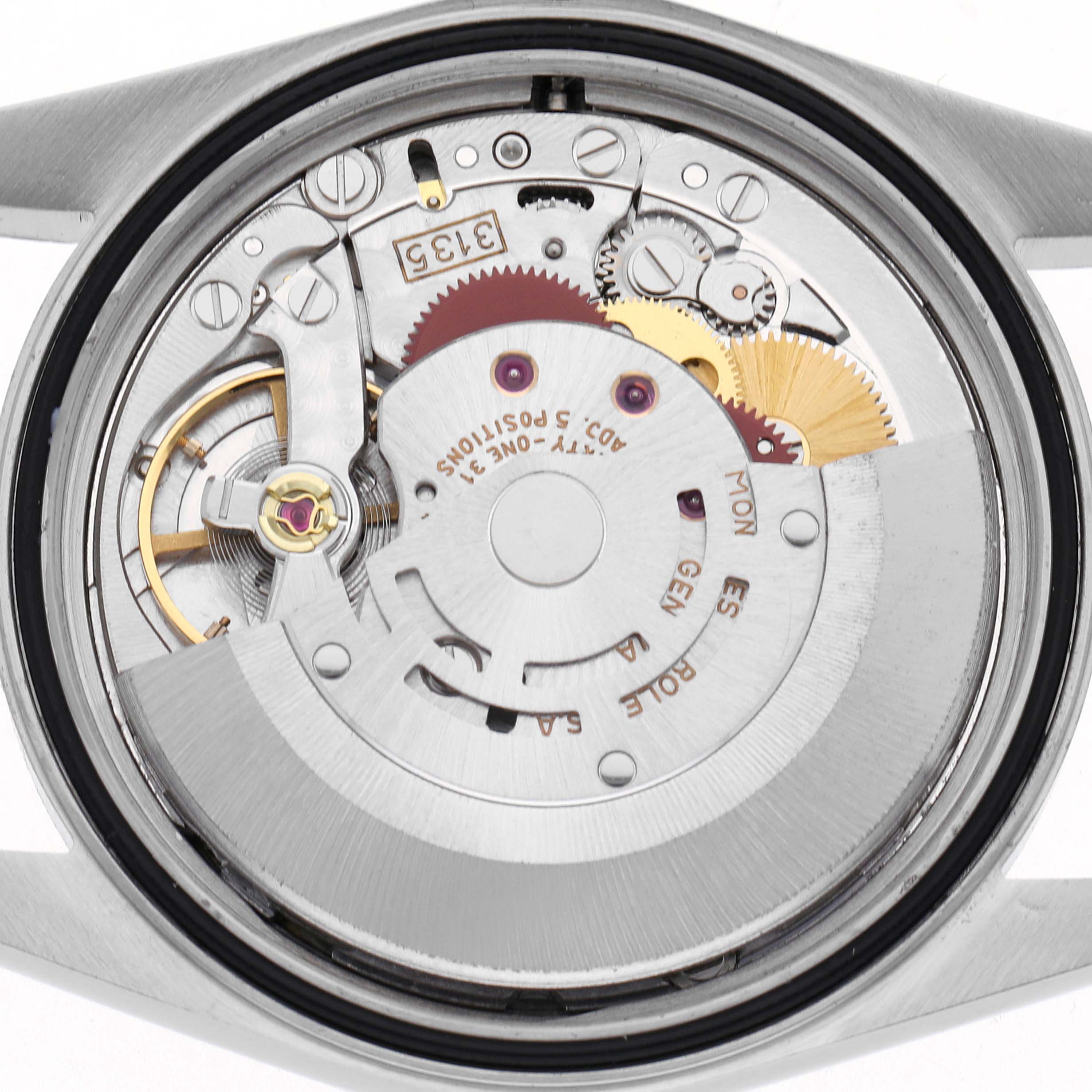 The image shows the movement of a Rolex Datejust 16233 Men
s Steel and Gold (two tone) Champagne Dial 16233 Men
s Steel and Gold (two tone) Champagne Dial watch from a top view, highlighting gears and internal mechanisms.