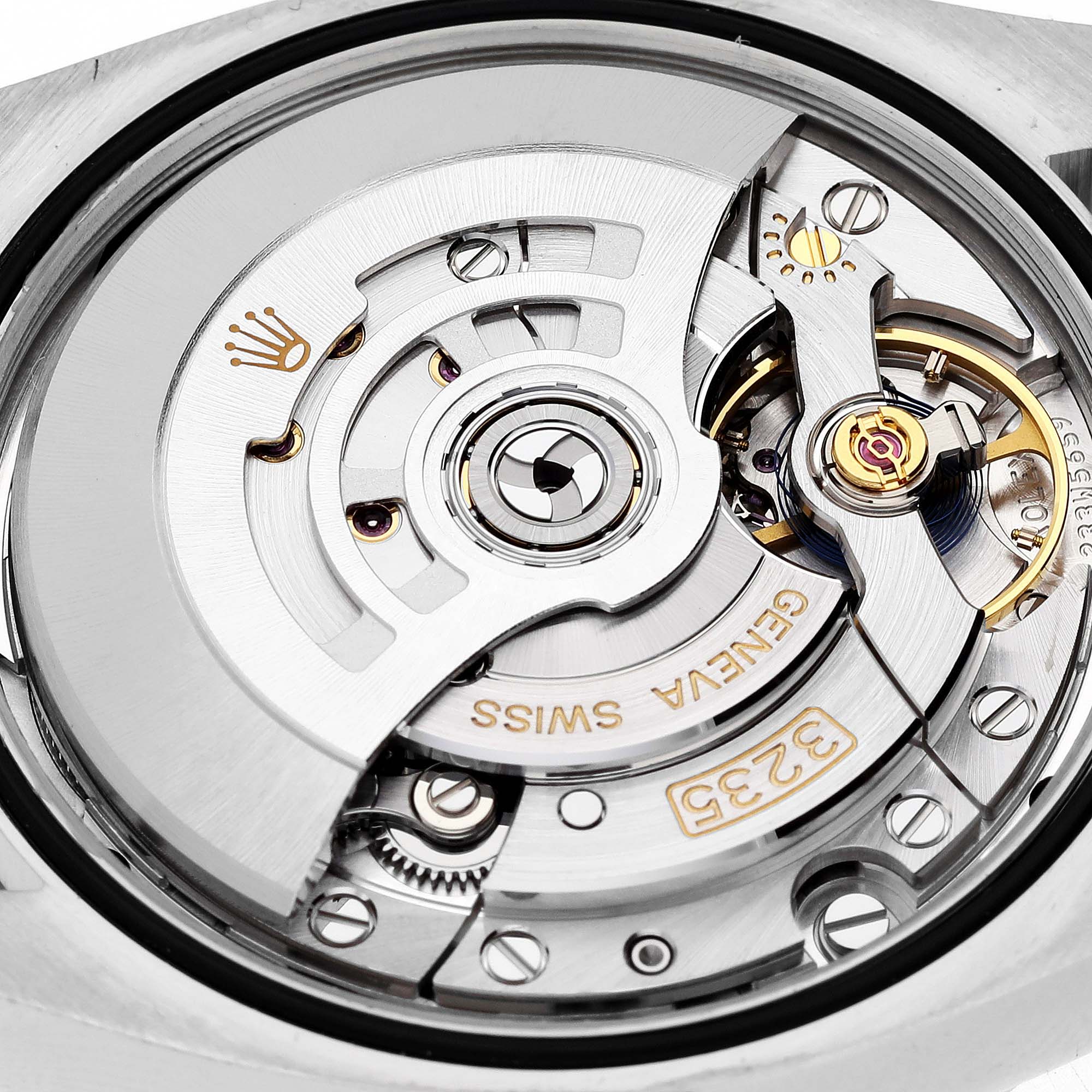 This is a close-up view of the movement inside a Rolex Datejust M126283RBR-0003 Men's Steel and Gold (two tone) Black Dial M126283RBR-0003 Men's Steel and Gold (two tone) Black Dial watch, showcasing intricate internal mechanics.