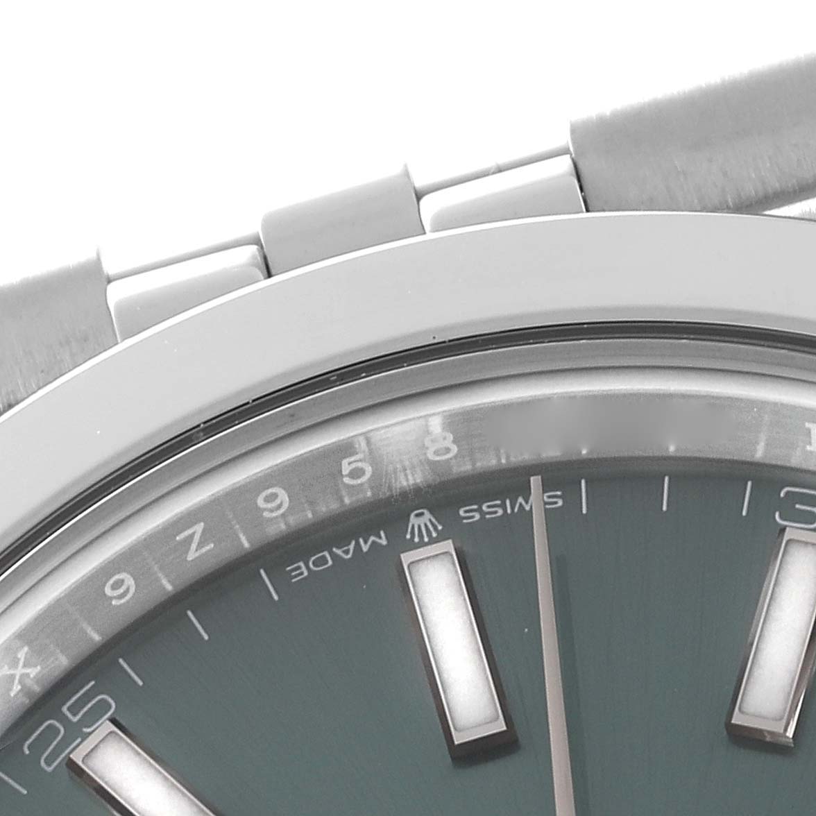 The image shows a close-up angle of the bezel, dial, and part of the bracelet of a Rolex Datejust 41 126300 Men
s Stainless Steel Green Dial 126300 Men
s Stainless Steel Green Dial watch.