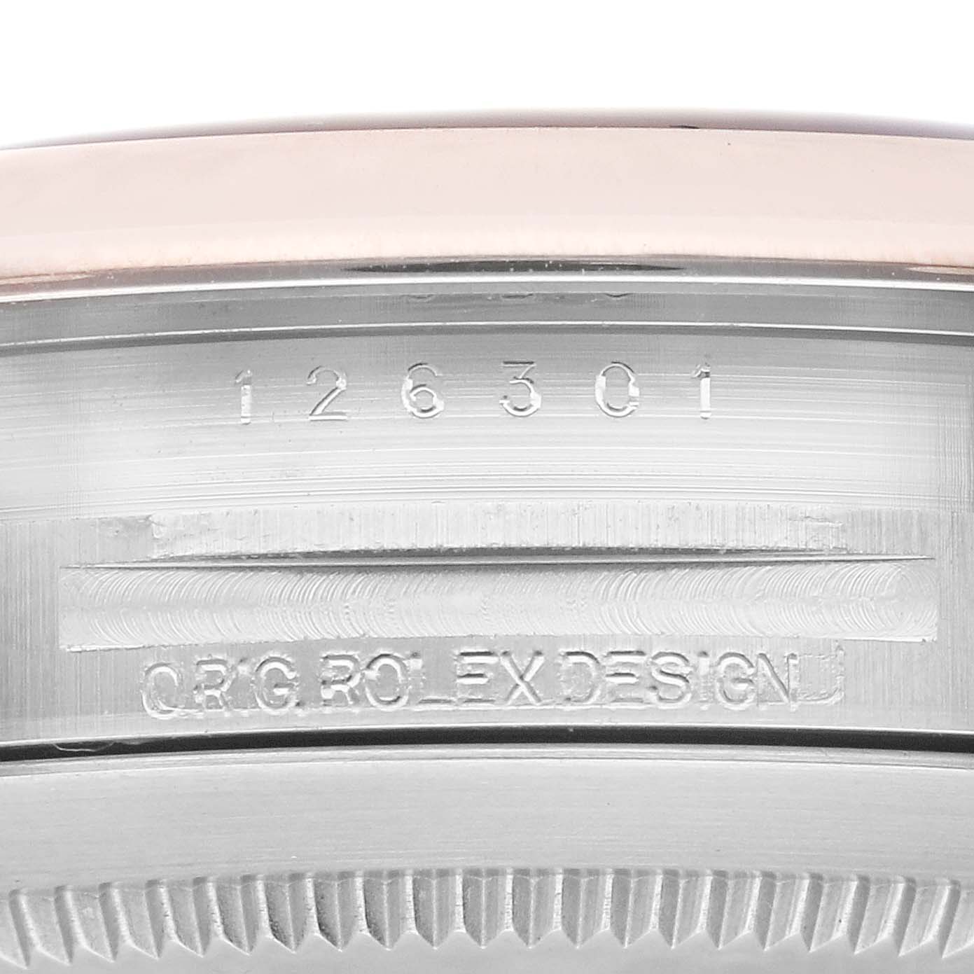 This image shows a close-up of the serial number and engraving on the side of the Rolex Datejust 41 126301 Men's Steel and Gold (two tone) Grey Dial 126301 Men's Steel and Gold (two tone) Grey Dial watch case.