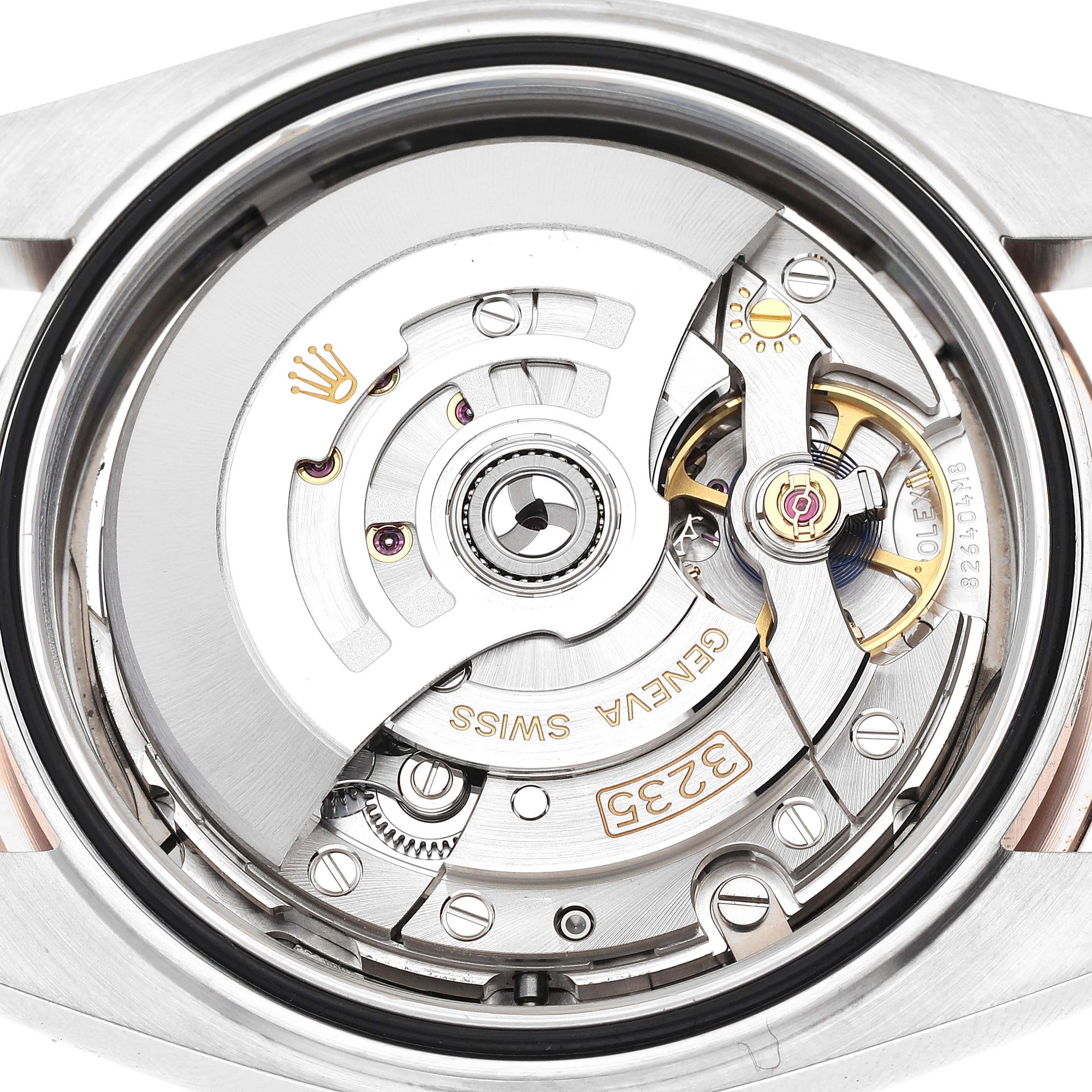 The image shows the intricate internal mechanism of the Rolex Datejust 41 126301 Men's Steel and Gold (two tone) Grey Dial 126301 Men's Steel and Gold (two tone) Grey Dial model, viewed from the back.
