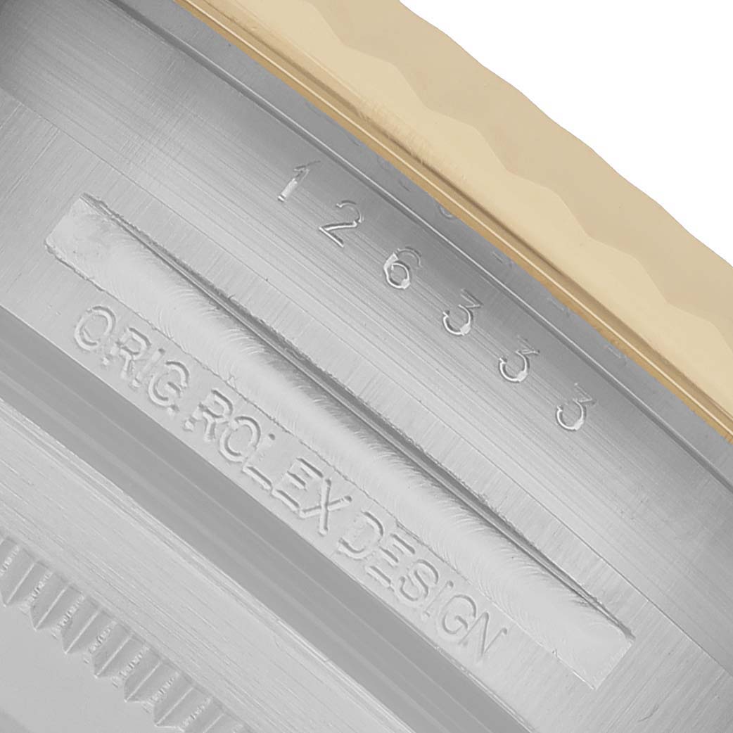 The image shows a close-up of the case side of a Rolex Datejust 41 126333 Men's Steel and Gold (two tone) Champagne Dial, highlighting the engraving and part of the bezel.