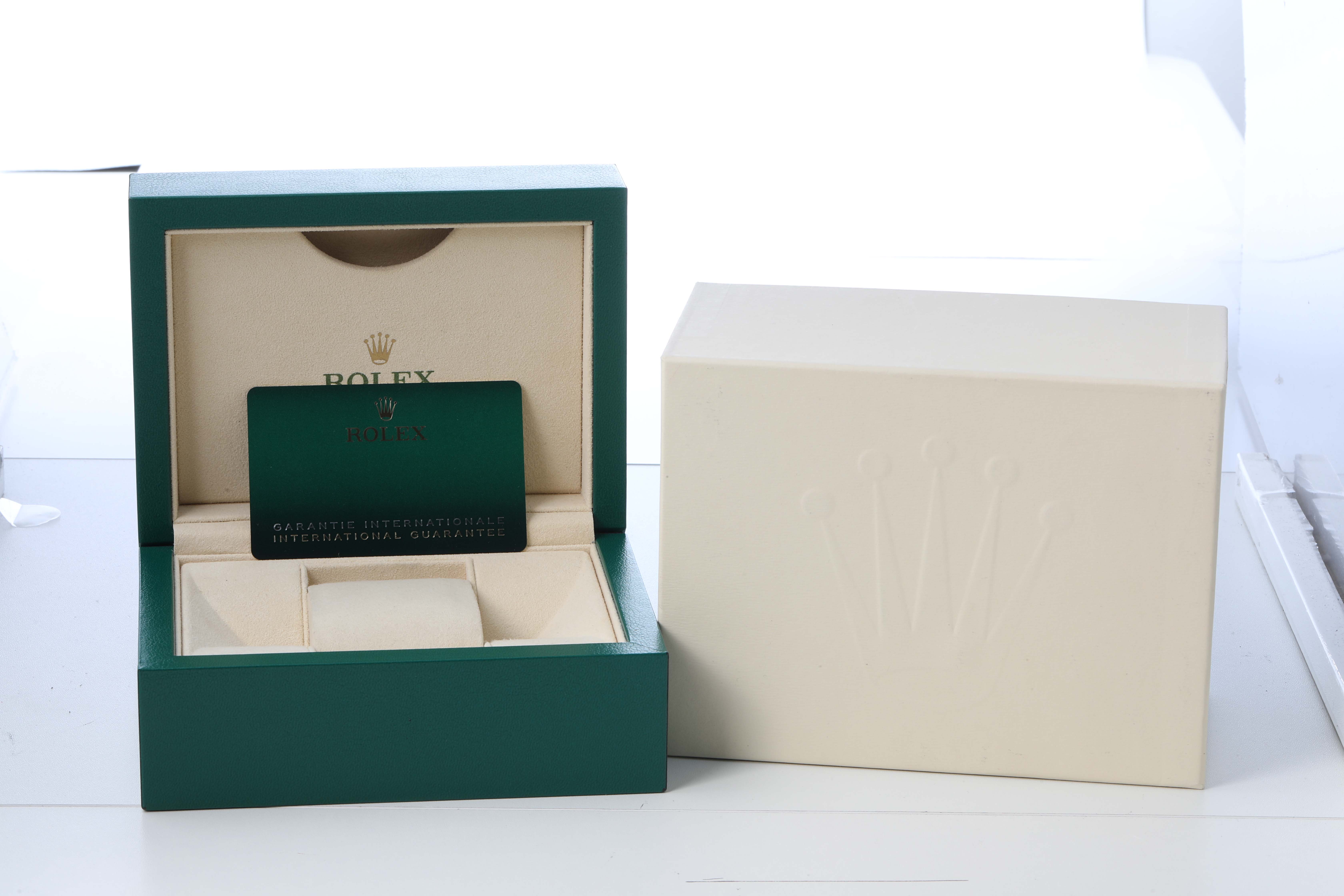 The image shows a Rolex Datejust 41 126333 Men's Steel and Gold (two tone) Champagne Dial watch box and card, with an open green interior angled forward.