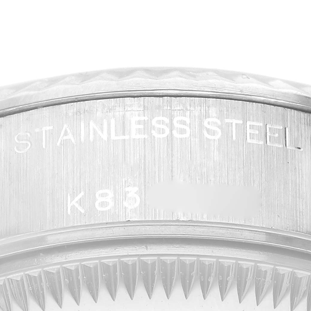 This close-up image shows the edge and case back of a Rolex Datejust 79174 Women's Stainless Steel Blue Dial 79174 Women's Stainless Steel Blue Dial, highlighting the "STAINLESS STEEL" engraving.