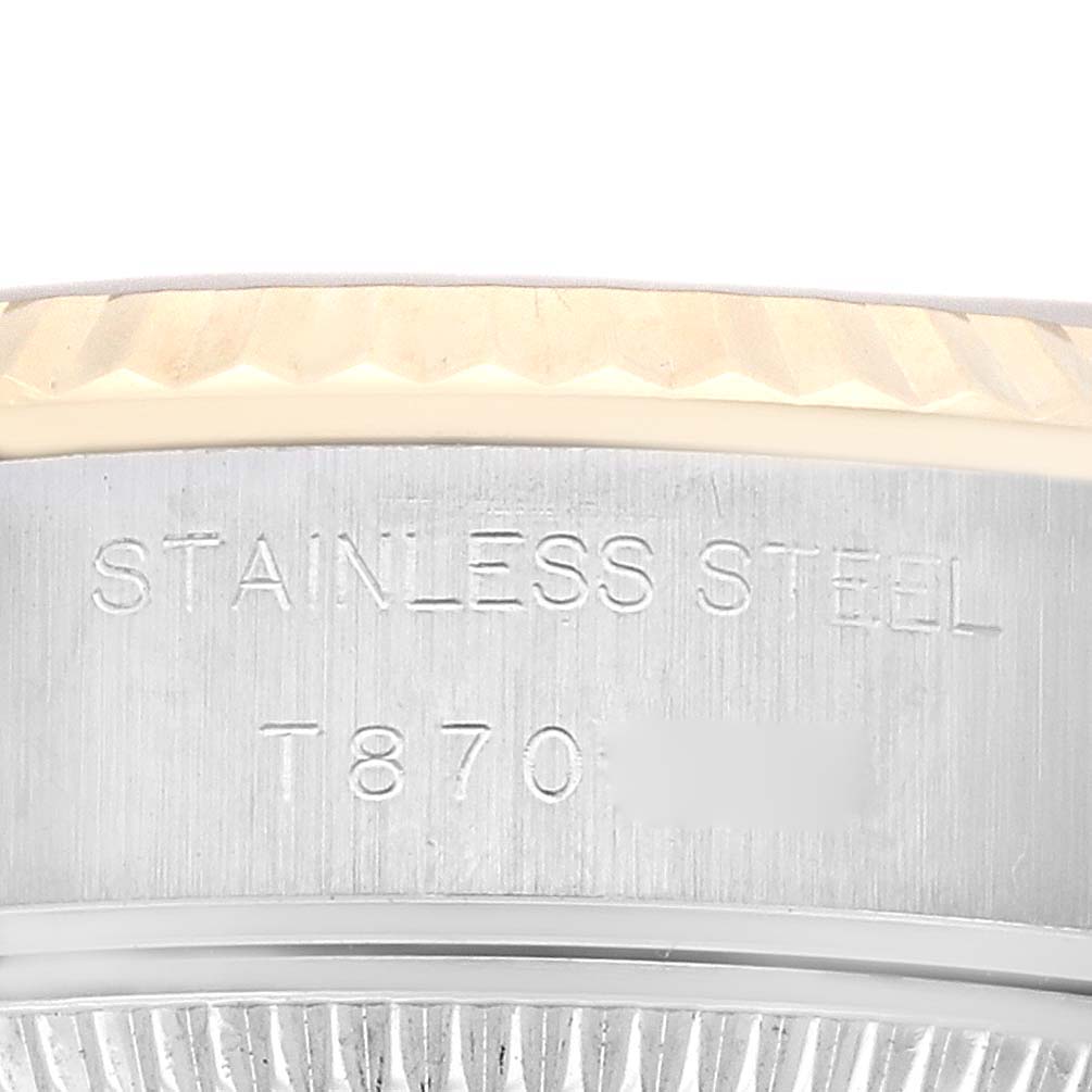 The image shows a close-up angle of the case side of the Rolex Datejust 69173 Women's Steel and Gold (two tone) Champagne Dial 69173 Women's Steel and Gold (two tone) Champagne Dial watch, focusing on the stainless steel marking.