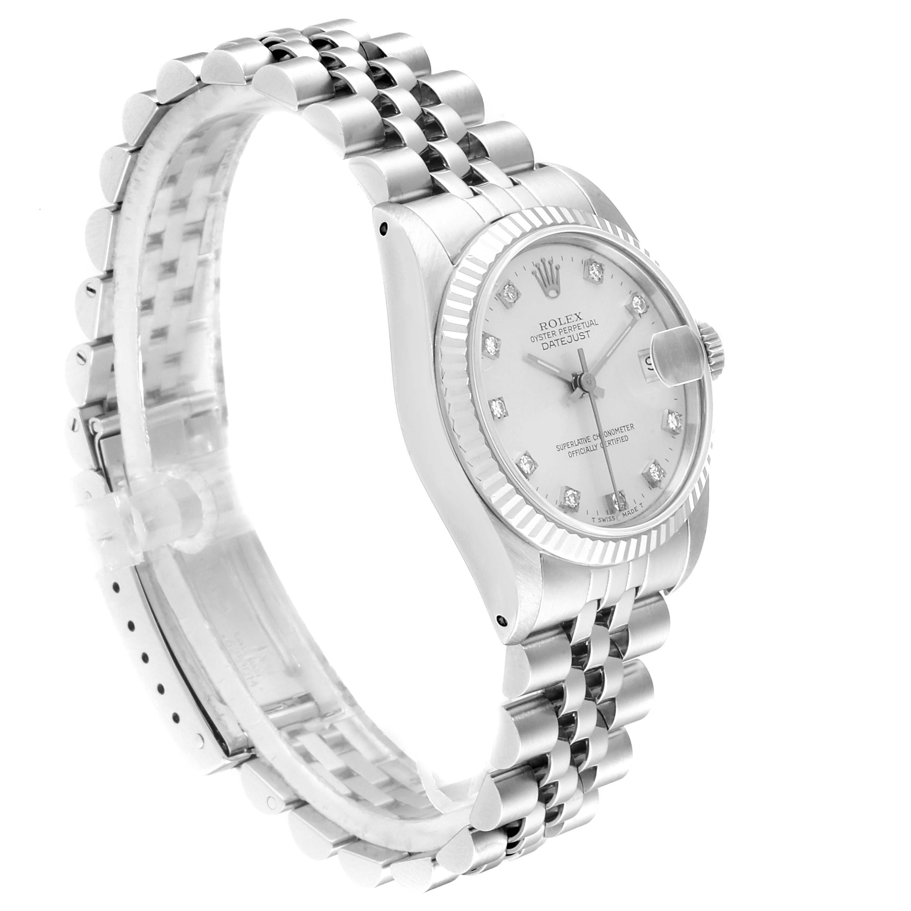 This image shows a side view of a Rolex Datejust 68274 Women's Stainless Steel Silver Dial 68274 Women's Stainless Steel Silver Dial watch, focusing on its textured bezel, bracelet, crown, and partially on the dial.