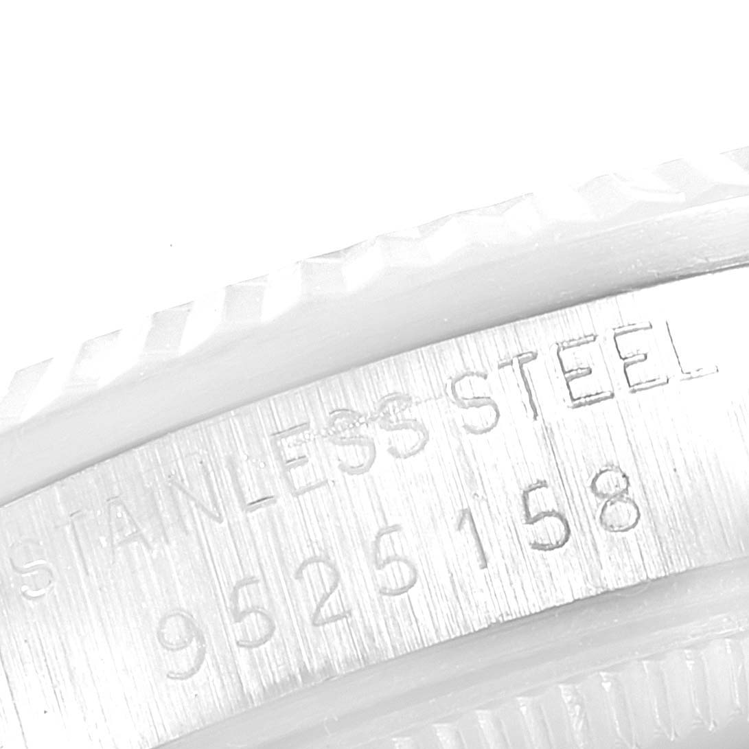 This image shows a close-up of the serial number and "STAINLESS STEEL" engraving on the bezel edge of a Rolex Datejust 68274 Women's Stainless Steel Silver Dial 68274 Women's Stainless Steel Silver Dial watch.