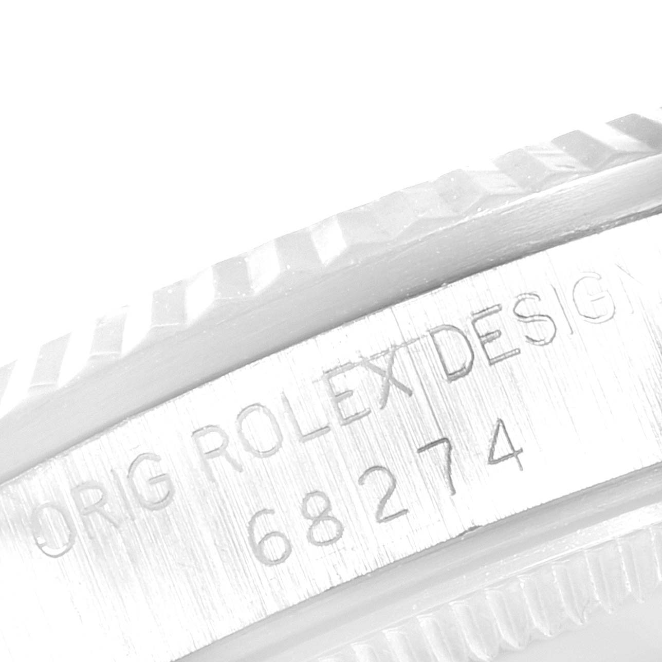 This image shows a close-up of the bezel and the engraved serial number of a Rolex Datejust 68274 Women's Stainless Steel Silver Dial 68274 Women's Stainless Steel Silver Dial watch.