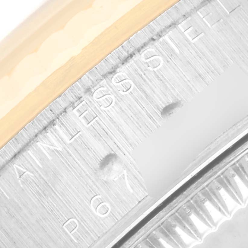 The image shows a close-up of the stainless steel case back and logo of a Rolex Mid-Size 78273 Women's Steel and Gold (two tone) Red Dial 78273 Women's Steel and Gold (two tone) Red Dial model watch.