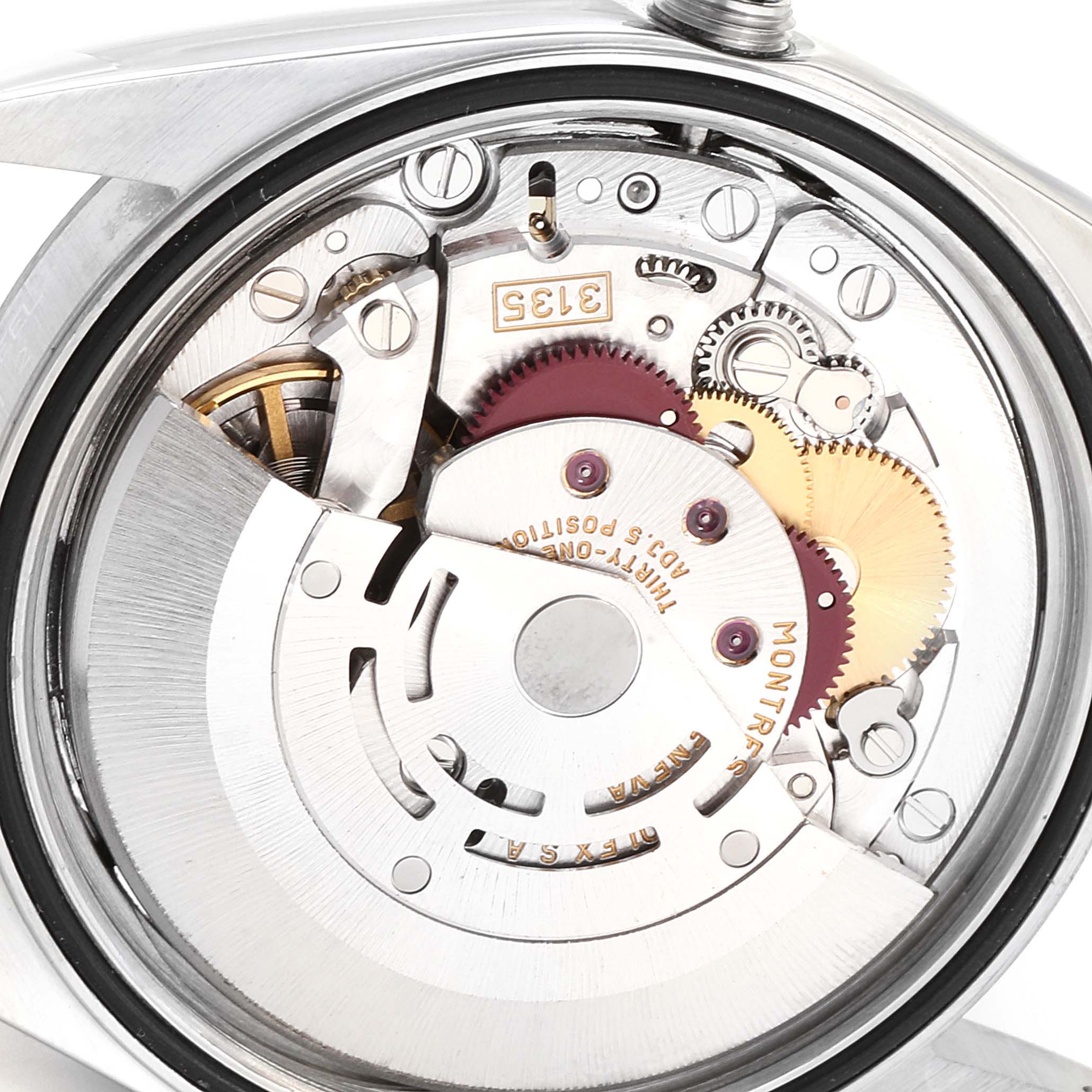 The image shows the internal mechanism of a Rolex Datejust 16234 Men
s Stainless Steel Blue Dial 16234 Men
s Stainless Steel Blue Dial watch, viewed from the back, highlighting gears and movement parts.