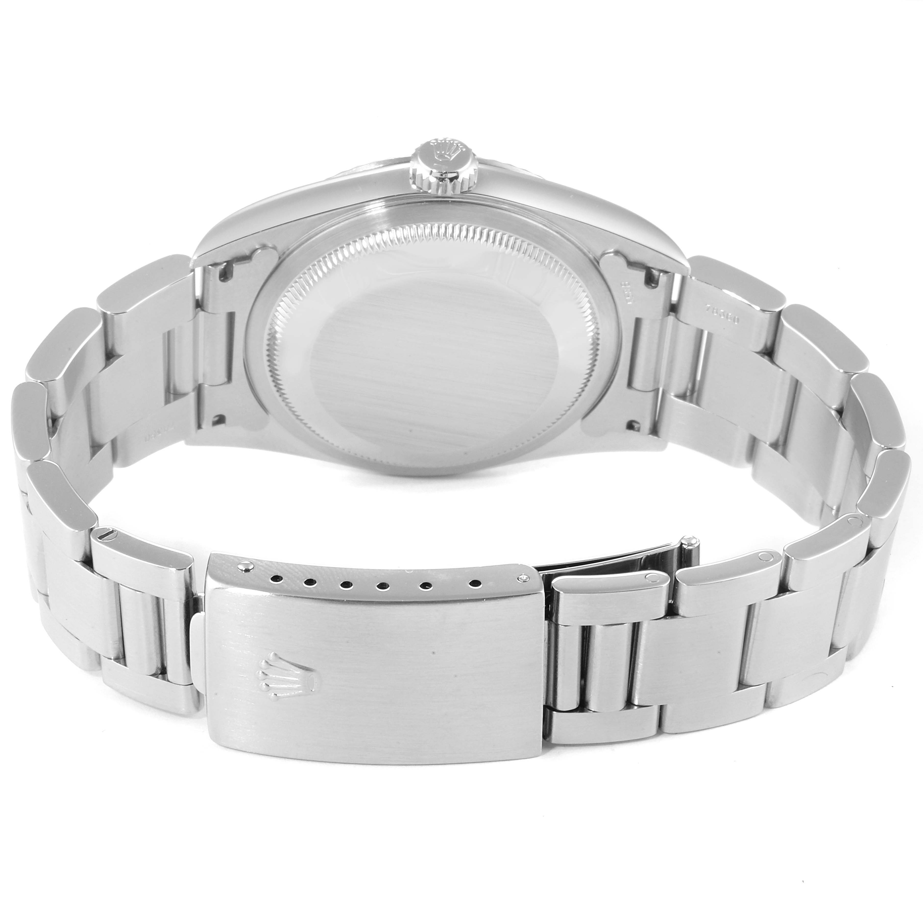 The image shows the backside of a Rolex Datejust 16234 Men
s Stainless Steel Blue Dial 16234 Men
s Stainless Steel Blue Dial watch, highlighting the clasp and bracelet.