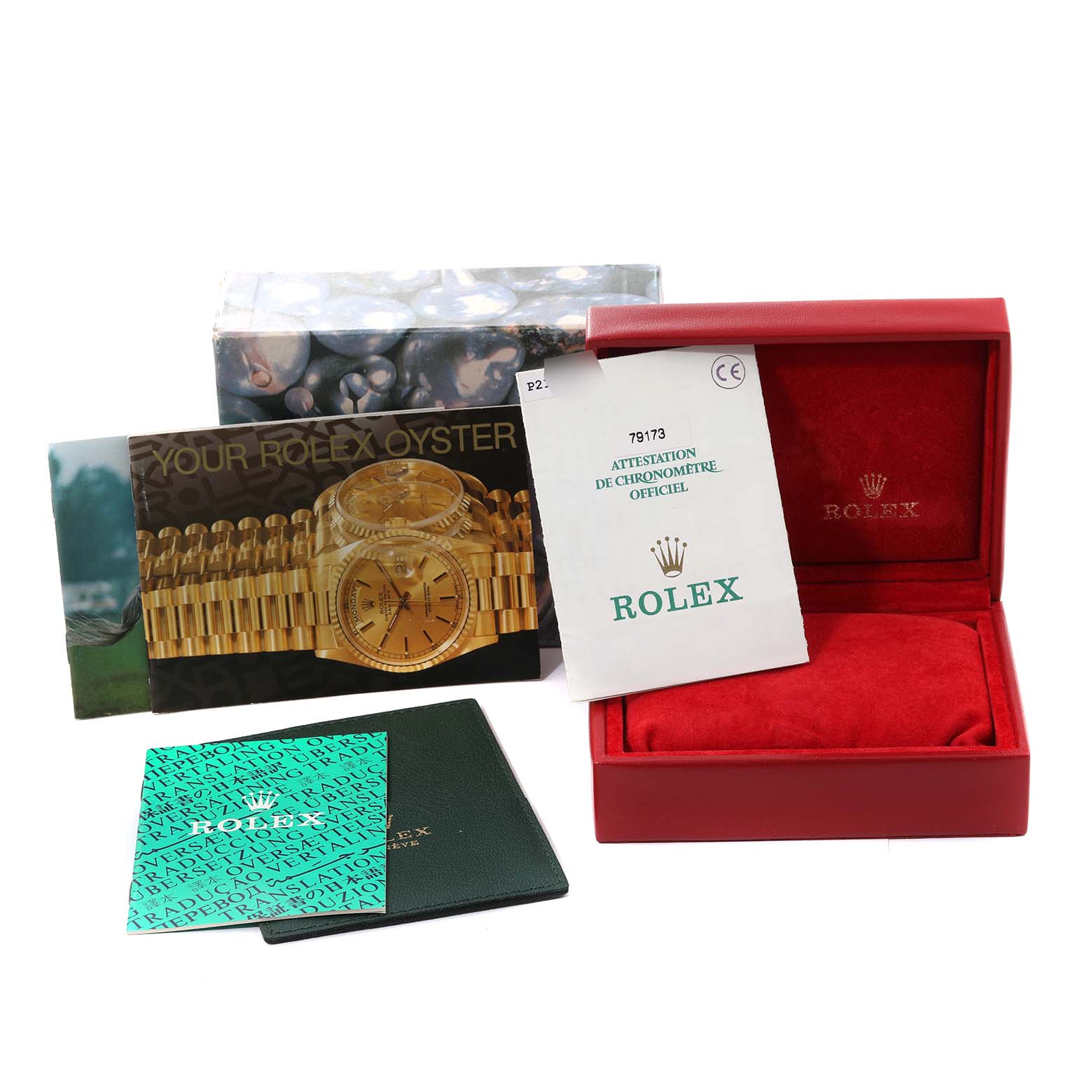 The image shows a Rolex Datejust 79173 Women's Steel and Gold (two tone) Beige Dial 79173 Women's Steel and Gold (two tone) Beige Dial watch box, booklets, warranty card, and a red watch case from a frontal angle.