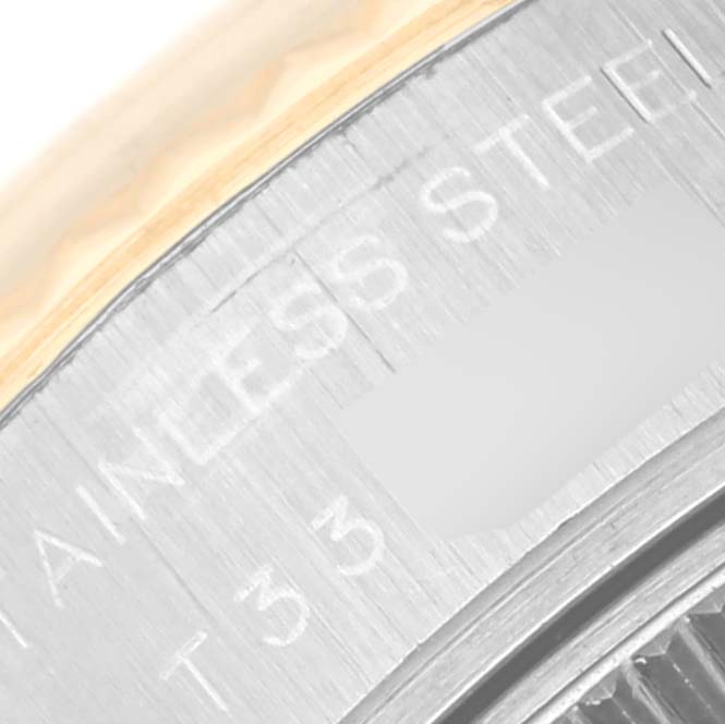 This image shows a close-up of the bezel and part of the text on the case of a Rolex Datejust 69173 Women's Steel and Gold (two tone) Blue Dial 69173 Women's Steel and Gold (two tone) Blue Dial watch.
