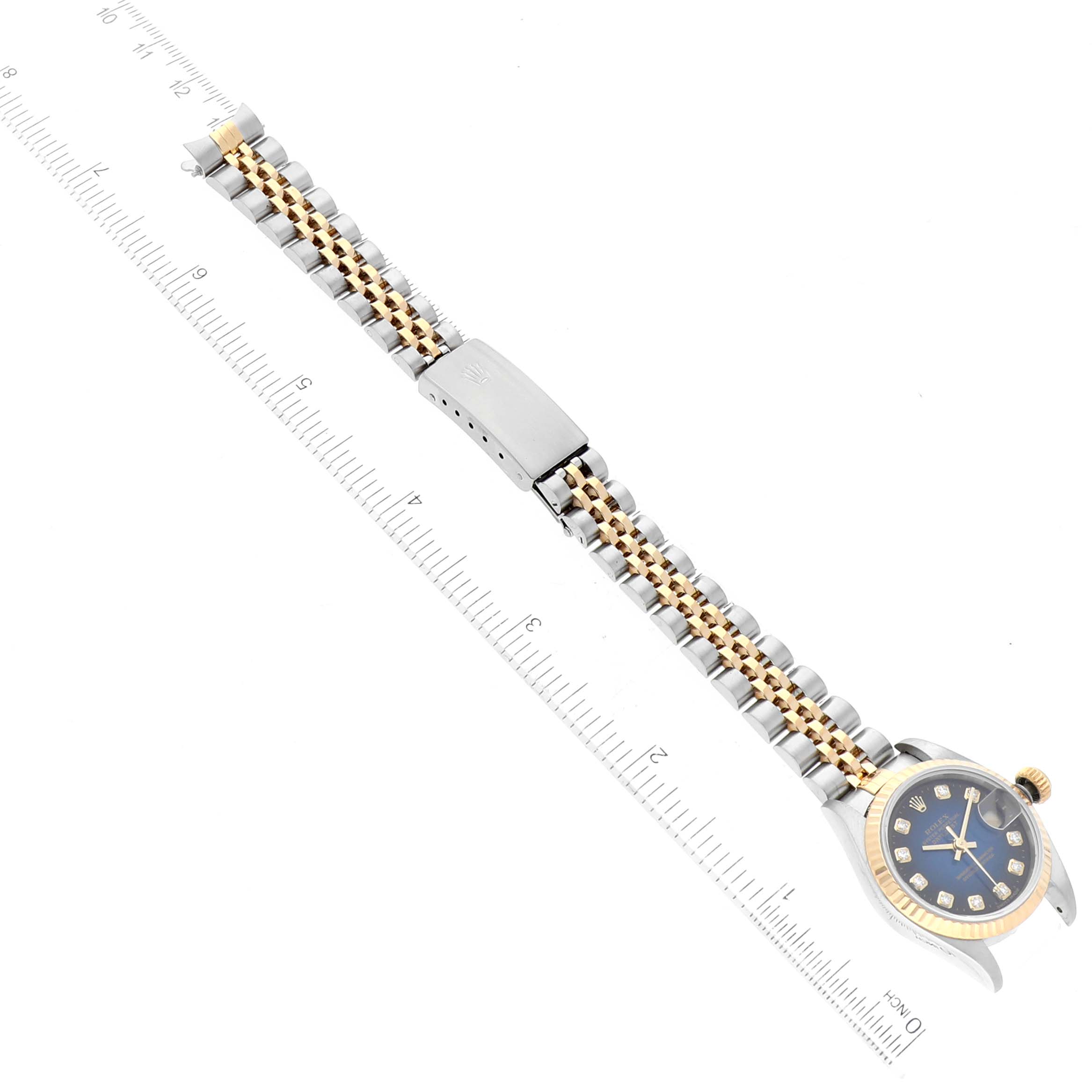 The Rolex Datejust 69173 Women's Steel and Gold (two tone) Blue Dial 69173 Women's Steel and Gold (two tone) Blue Dial model watch is shown from a top-down angle, displaying its face, bracelet, and clasp.