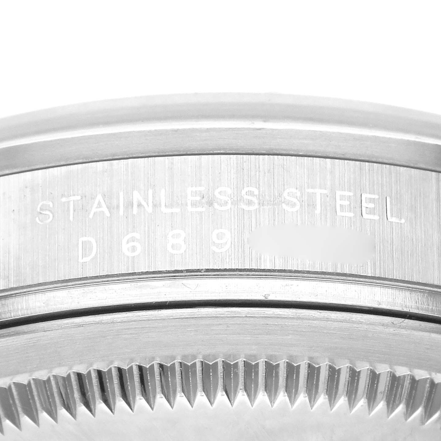 This close-up image shows the side of the stainless steel casing and the serial number of a Rolex Explorer 114270 Men
s Stainless Steel Black Dial 114270 Men
s Stainless Steel Black Dial watch.