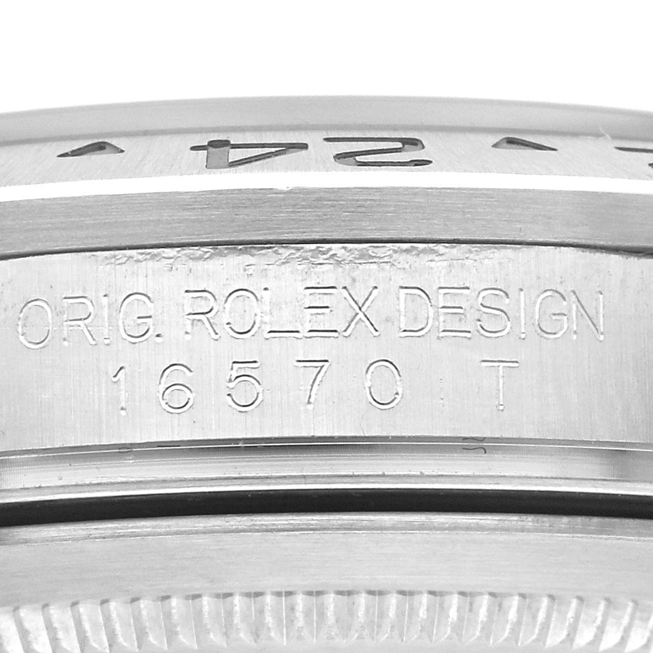 This close-up image shows the engraving on the side case of a Rolex Explorer 16570 Men
s Stainless Steel Black Dial 16570 Men
s Stainless Steel Black Dial model 16570T.