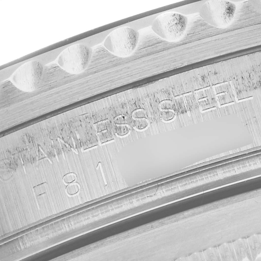 This close-up image shows the stainless steel engraving and part of the bezel on a Rolex GMT-Master 16710 Men
s Stainless Steel Black Dial 16710 Men
s Stainless Steel Black Dial watch.