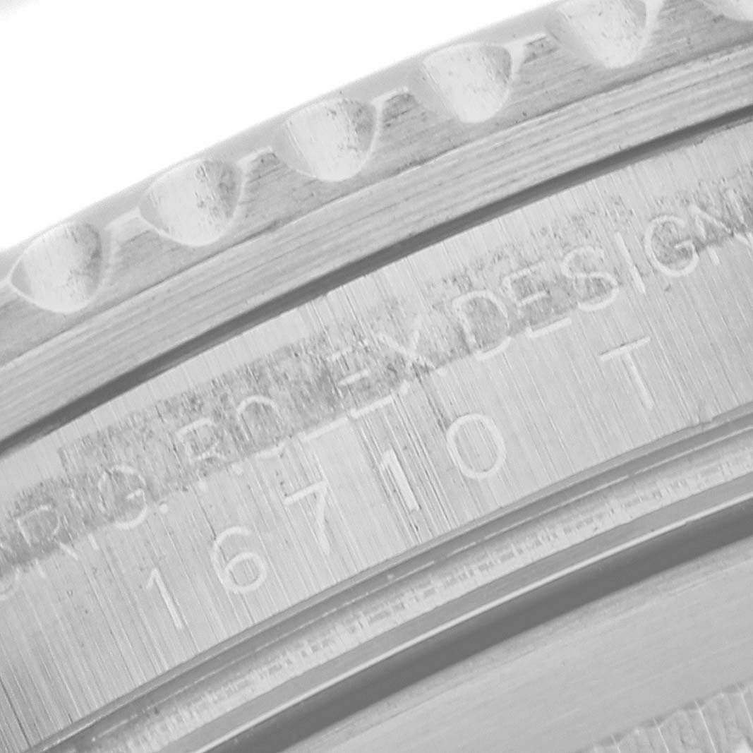 The image shows a close-up of the case side inscription on a Rolex GMT-Master 16710 Men
s Stainless Steel Black Dial 16710 Men
s Stainless Steel Black Dial, revealing the model number 16710.