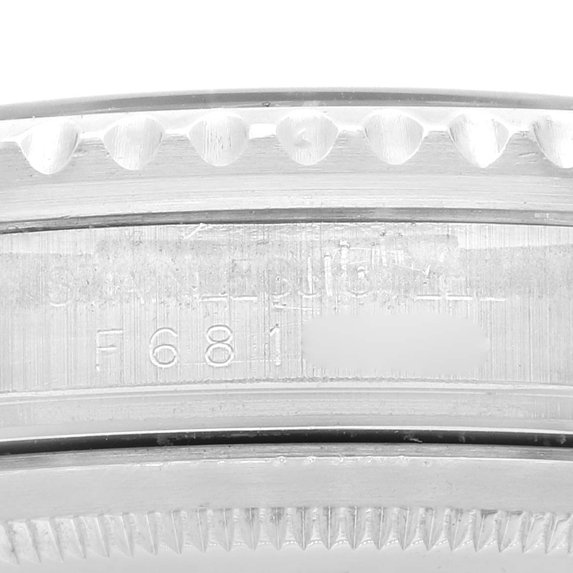 This image shows the side view of the casing and the serial number engraving on a Rolex GMT-Master 16710 Men
s Stainless Steel Black Dial 16710 Men
s Stainless Steel Black Dial watch.