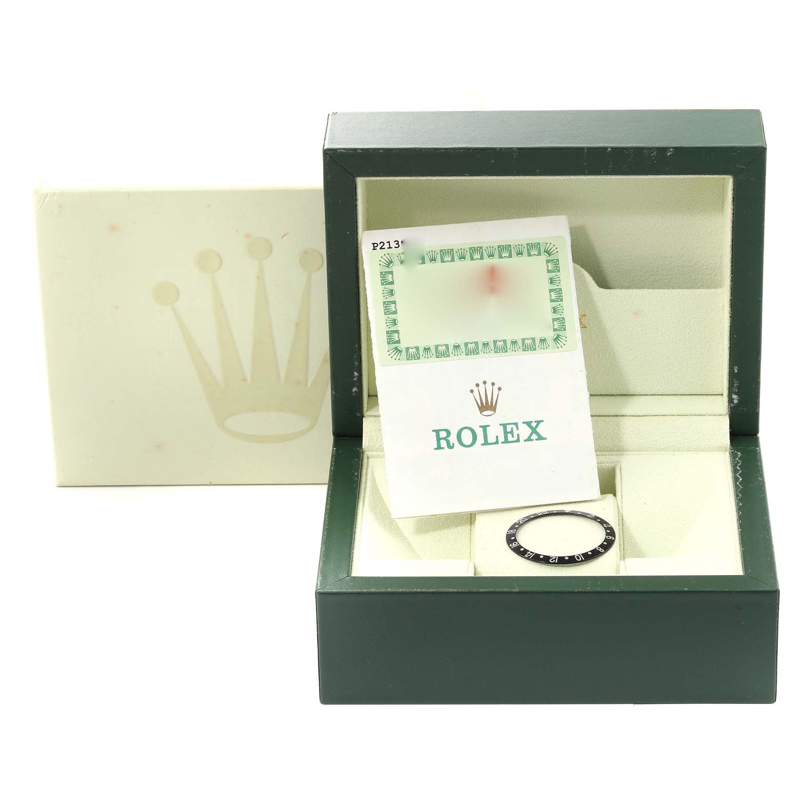 The image shows a Rolex GMT-Master 16710 Men's Stainless Steel Black Dial 16710 Men's Stainless Steel Black Dial accessory, specifically a bezel insert, inside its green presentation box with documentation.