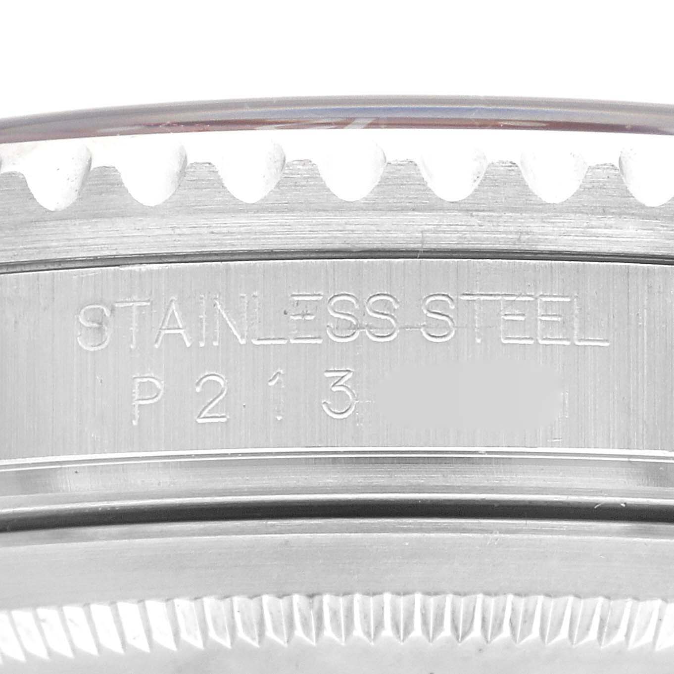 The image shows a close-up of the side of a stainless steel Rolex GMT-Master 16710 Men's Stainless Steel Black Dial 16710 Men's Stainless Steel Black Dial watch, highlighting the engraved serial number.