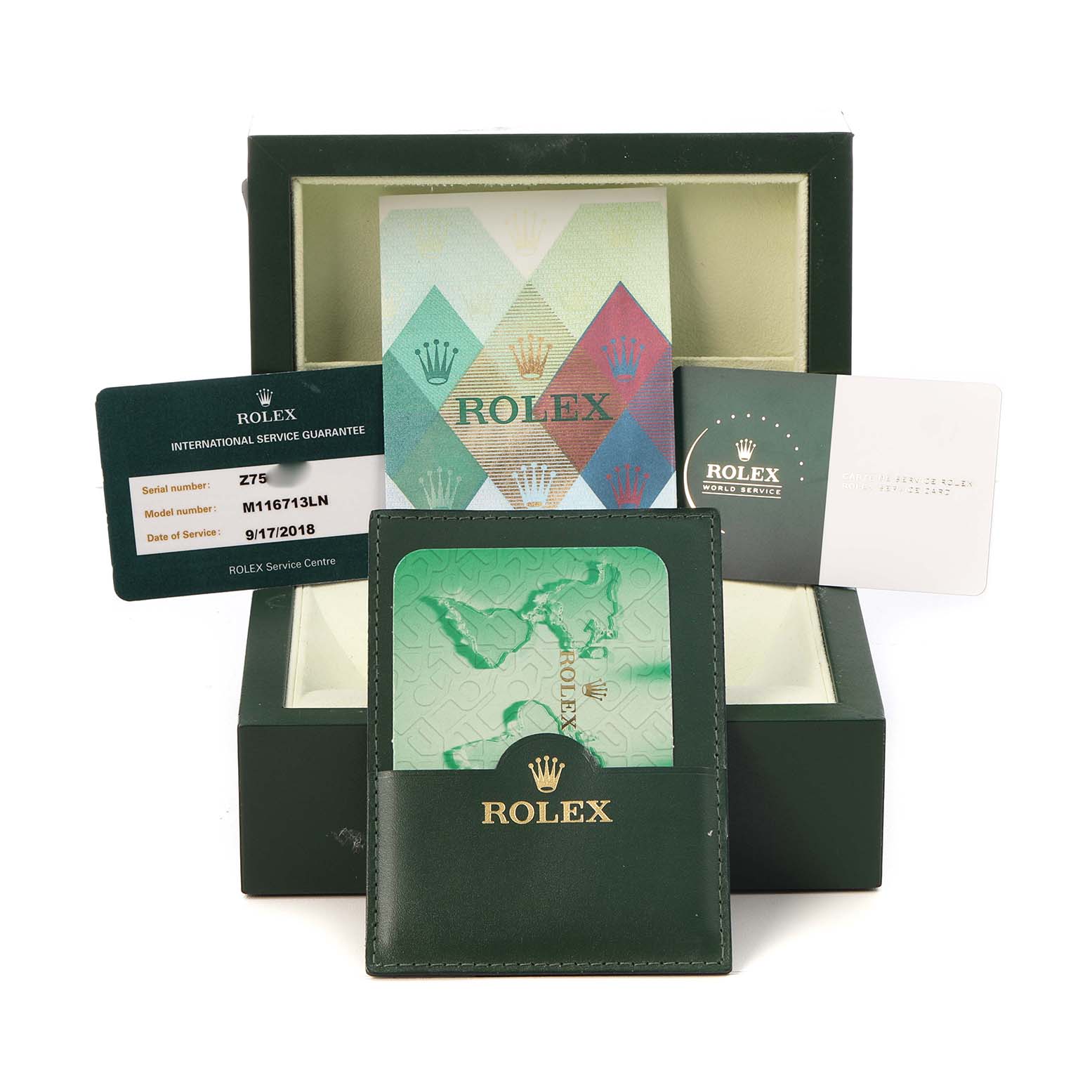 The image shows a Rolex GMT-Master M116713LN Men's Steel and Gold (two tone) Black Dial box with warranty cards and booklets, viewed from the front.