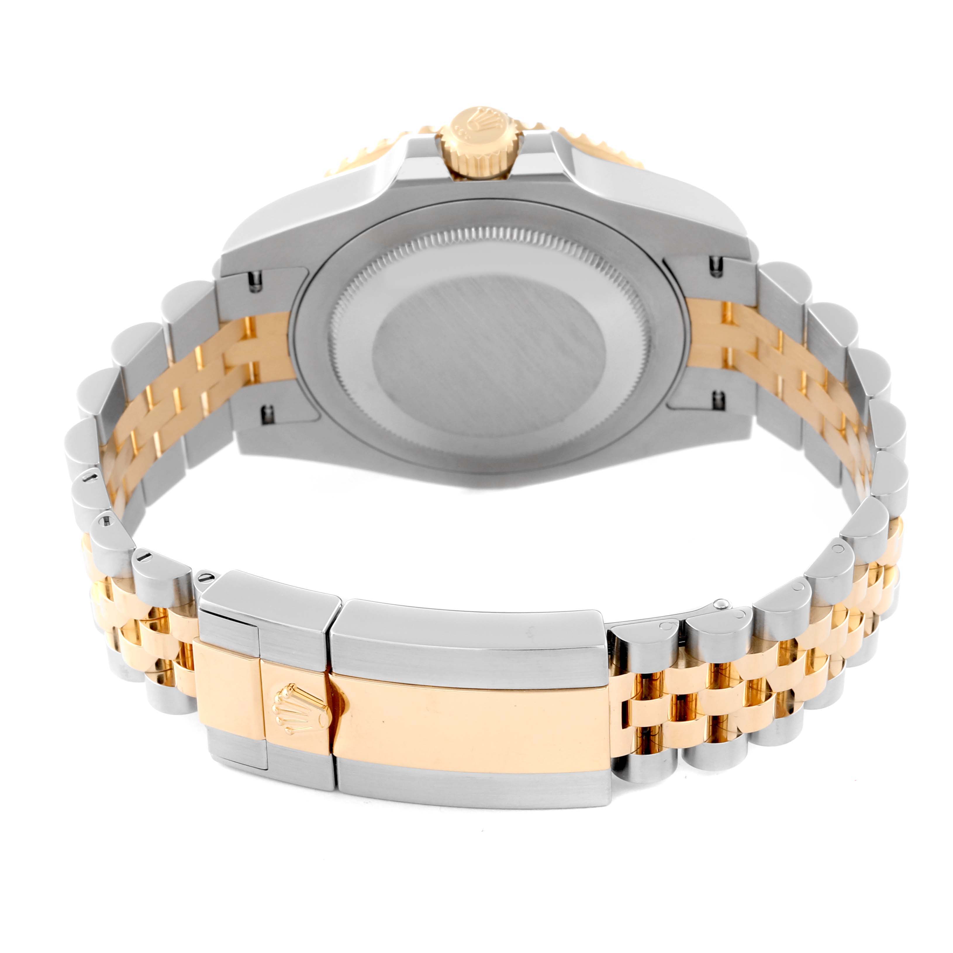 This image shows the Rolex GMT-Master 126713 Men's Steel and Gold (two tone) Black Dial 126713 Men's Steel and Gold (two tone) Black Dial watch from the rear, focusing on the case back and the two-tone bracelet with the clasp.