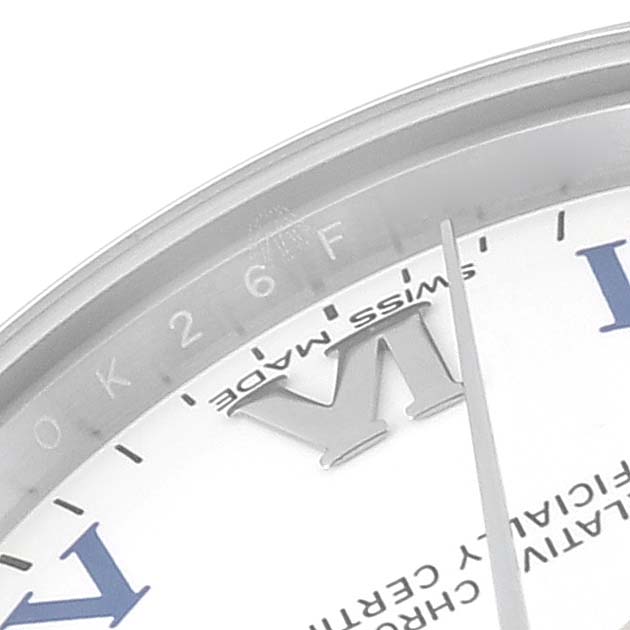 The image shows a close-up of the dial and bezel of a Mid-Size Rolex watch, highlighting the Roman numeral
s detail and the "Swiss Made" text.