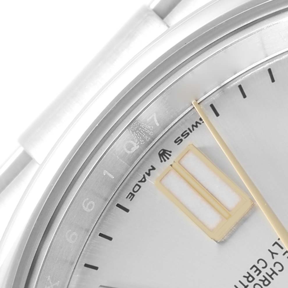 This close-up image shows a portion of the dial and indices of a Rolex Oyster Perpetual 124300 Men
s Stainless Steel Silver Dial 124300 Men
s Stainless Steel Silver Dial watch.