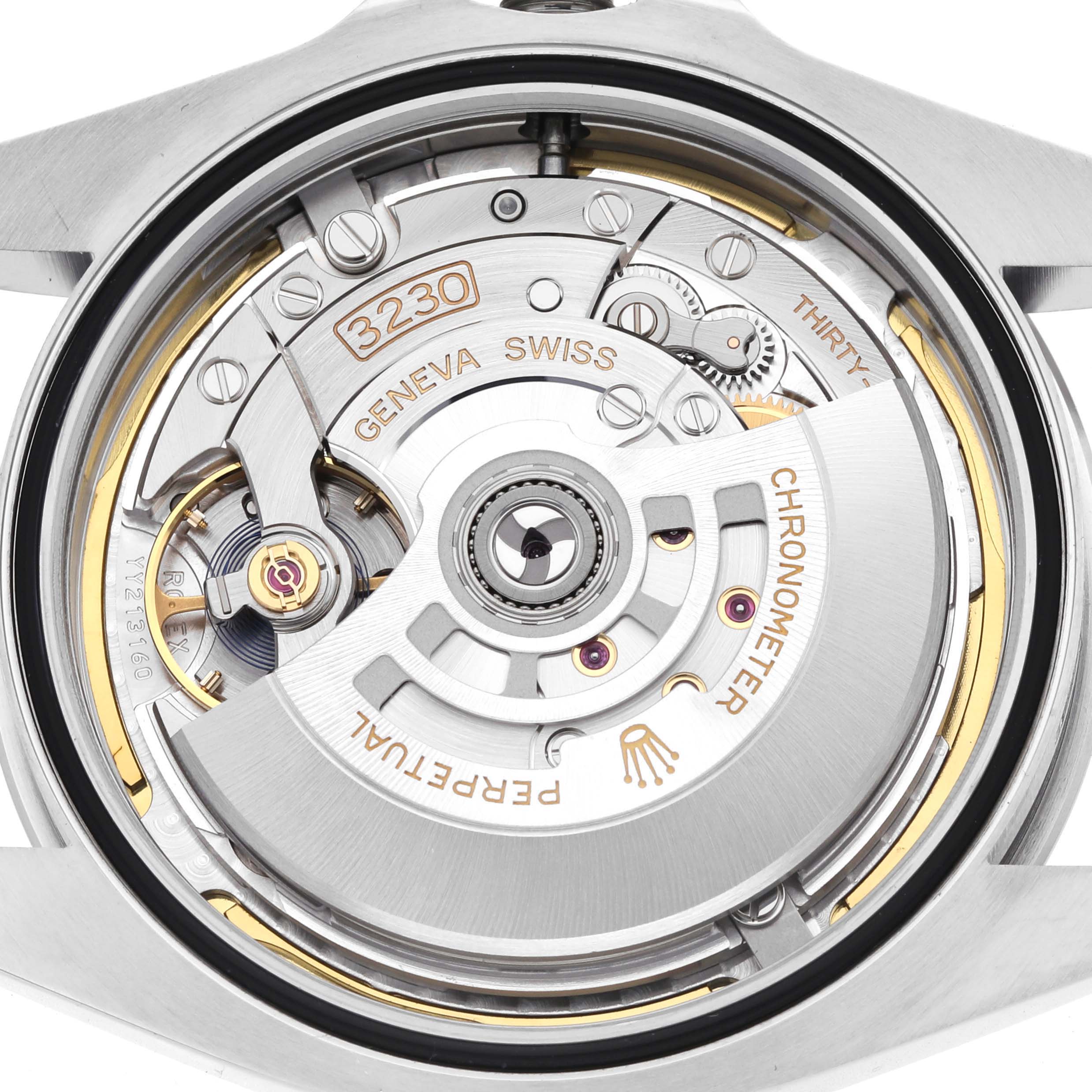 The image shows the open back view of the Rolex Air-King 126900 Men
s Stainless Steel Black Dial 126900 Men
s Stainless Steel Black Dial, highlighting the intricate movement and rotor mechanism.